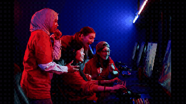 A diverse group of your esports players watching a game
