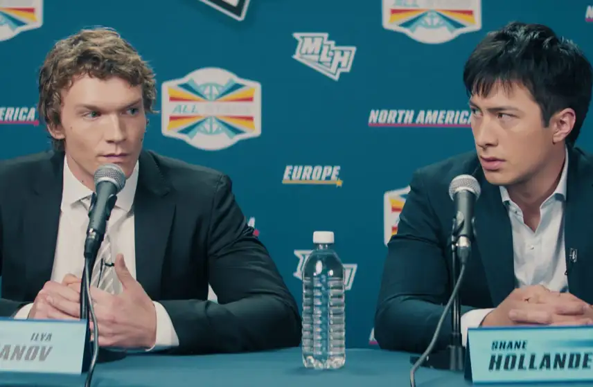 A still from Heated Rivalry showing the characters at a press conference.