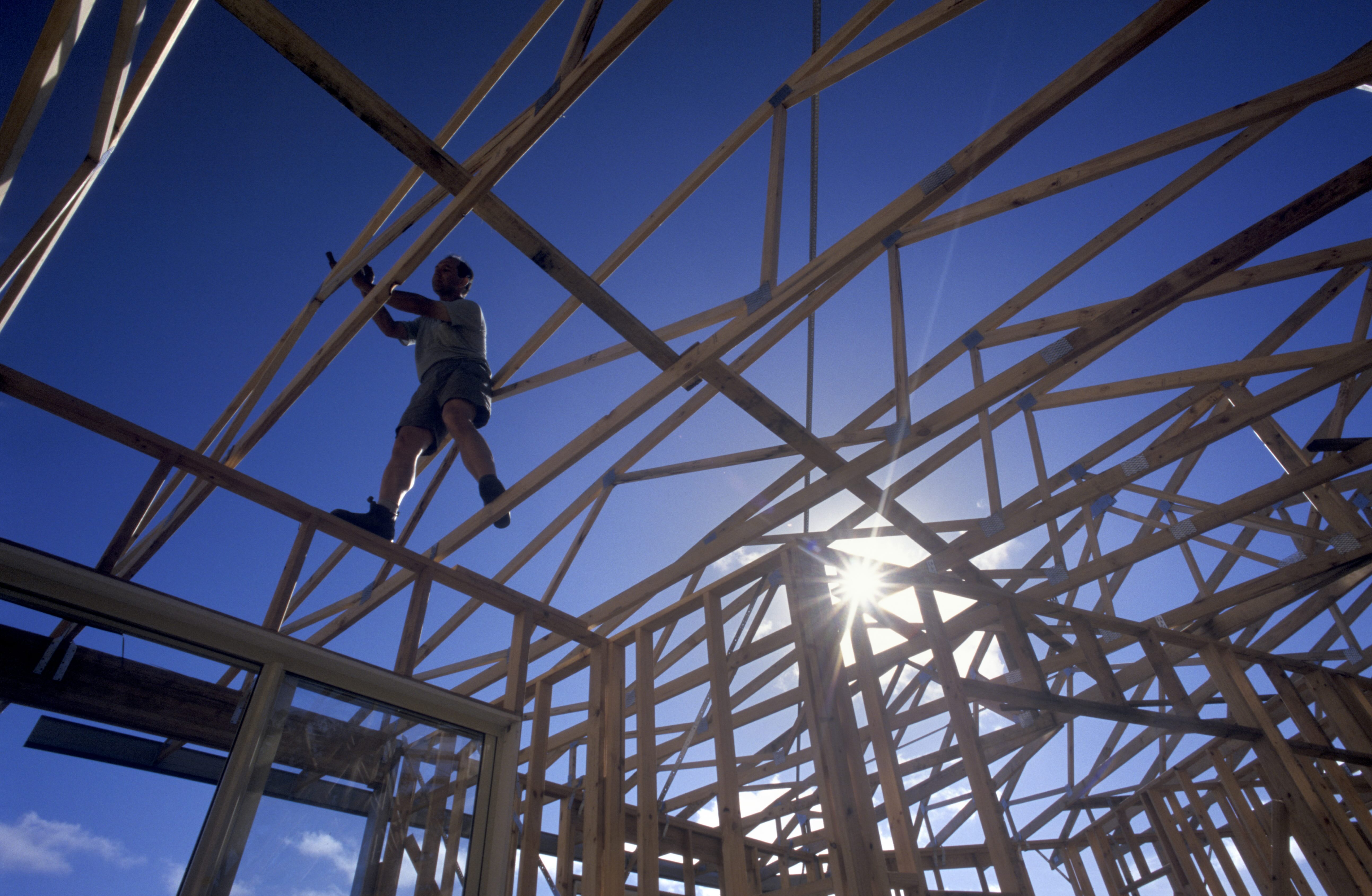 Builder on house frame