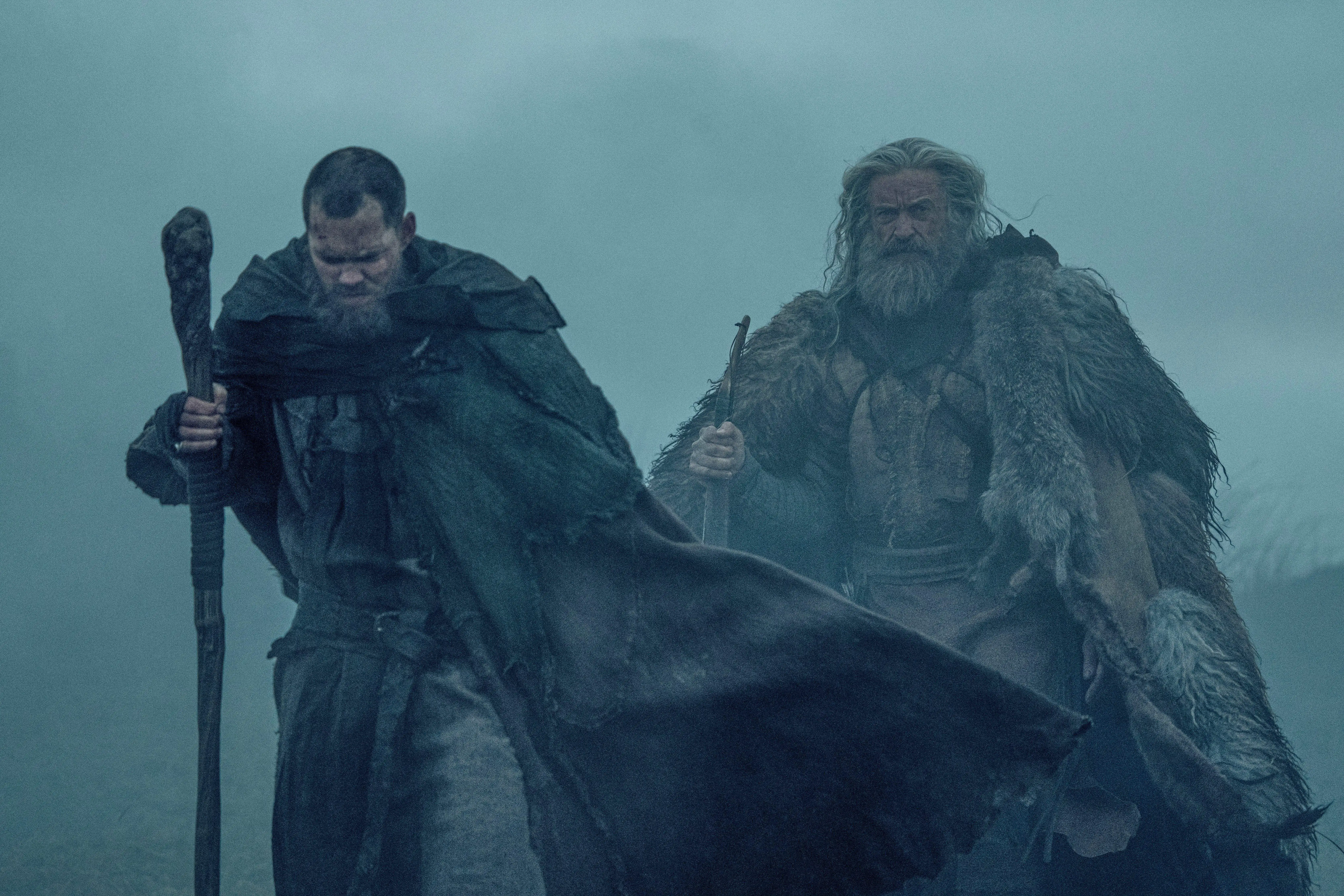 This image released by A24 shows Bill Skarsgård, left, and Hugh Jackman in a scene from The Death of Robin Hood.