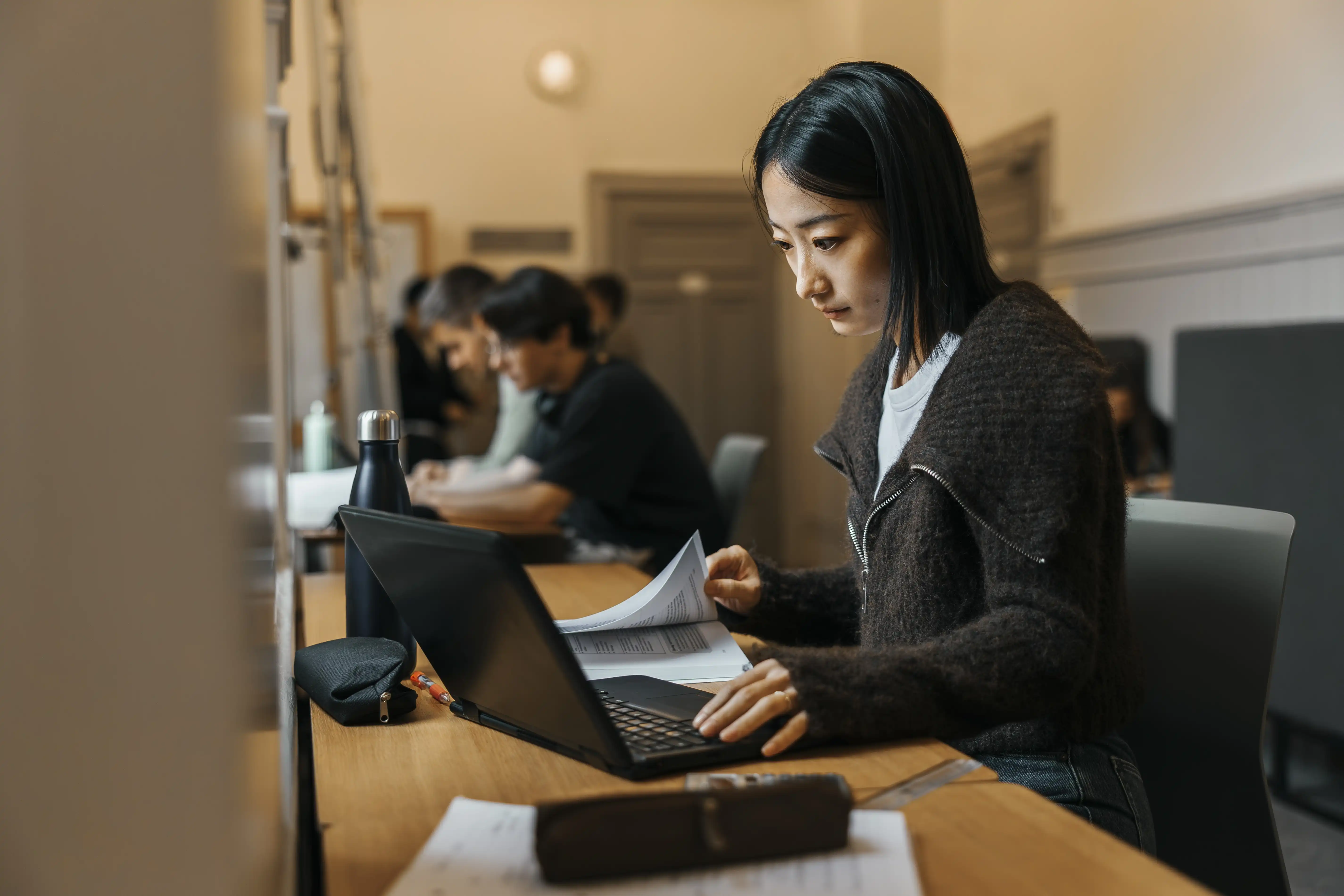 A young woman studying at a university library