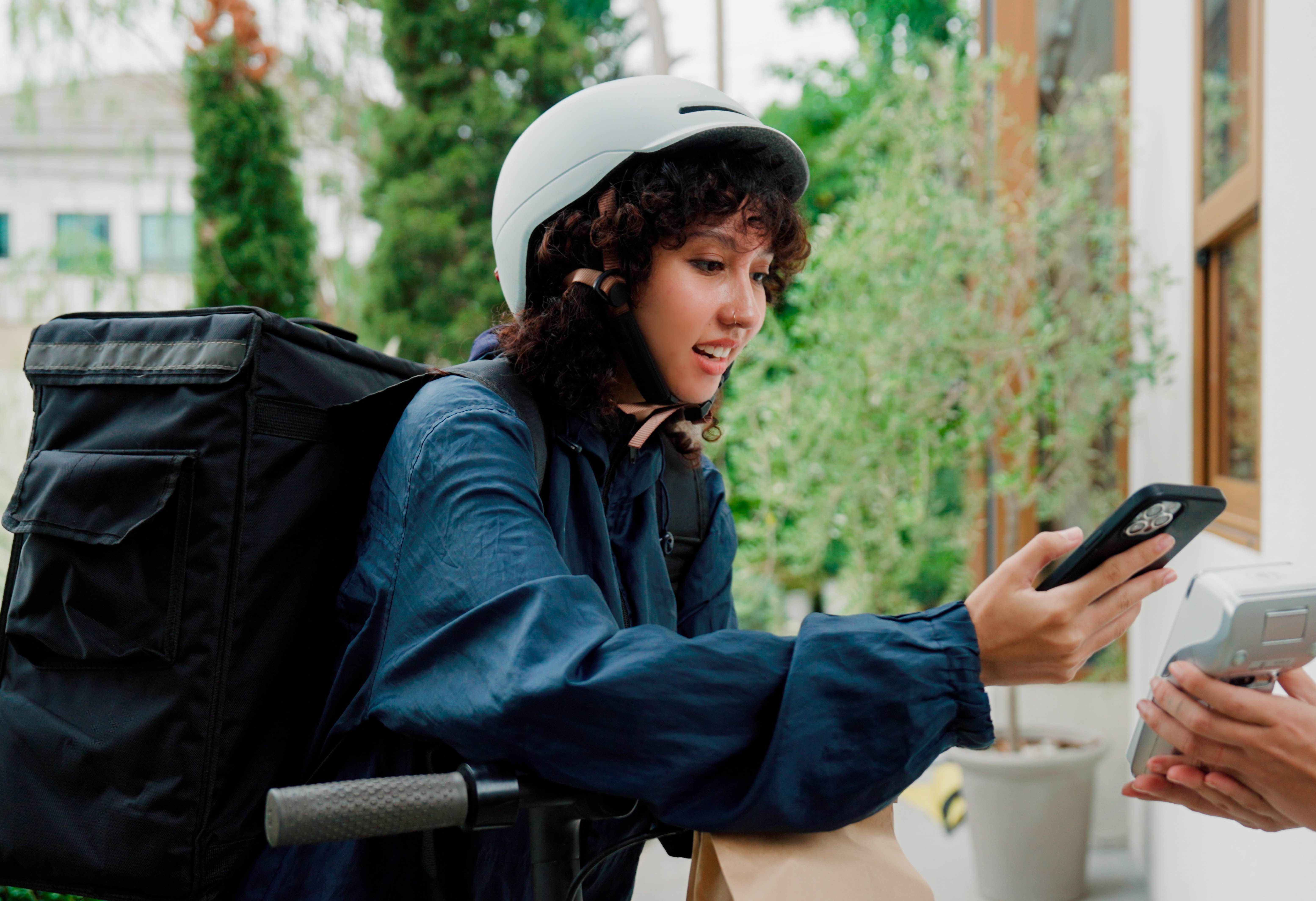 A young woman working as a delivery cyclist