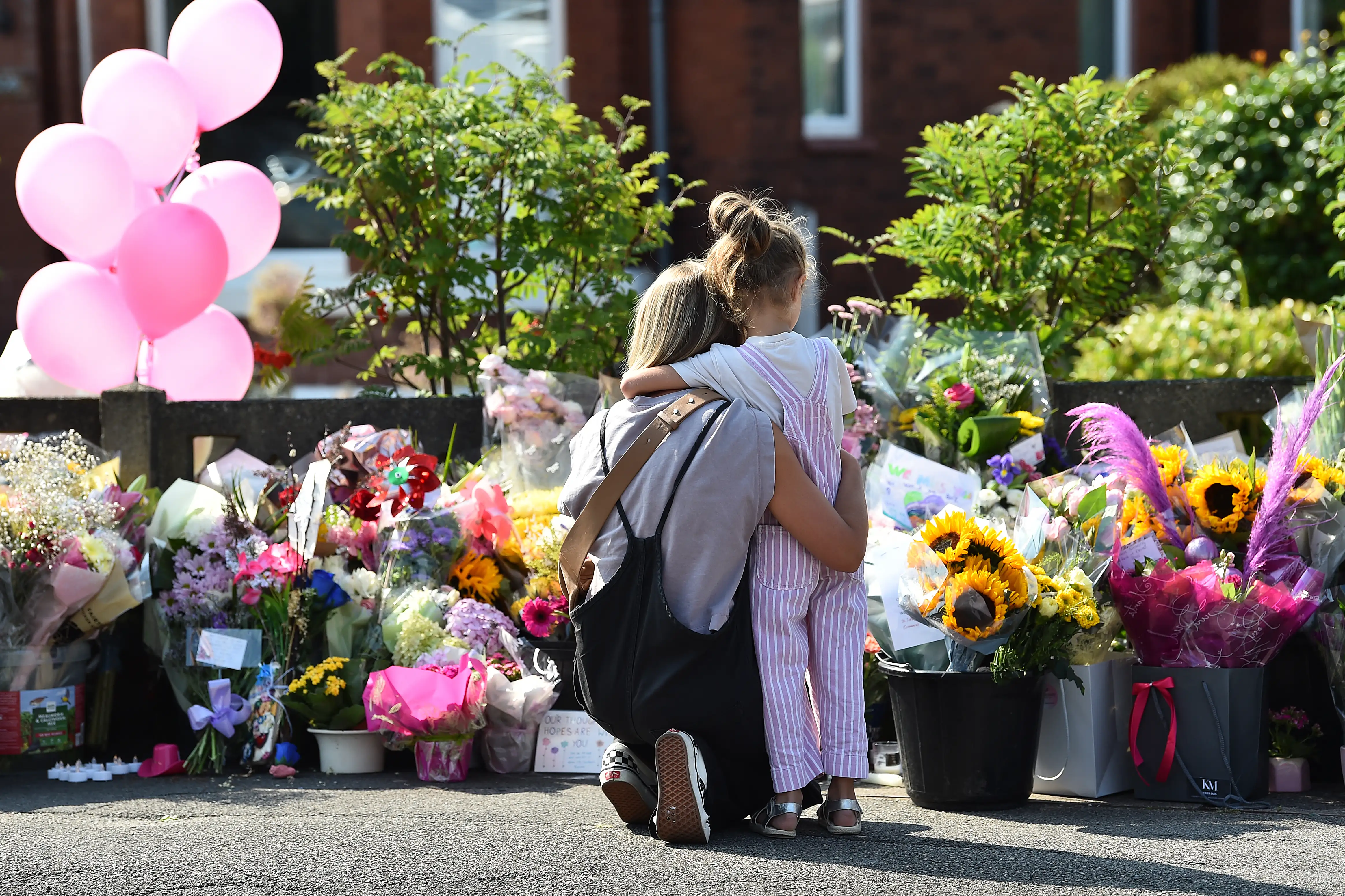 Floral tributes are left for the victims of a deadly knife attack in Southport