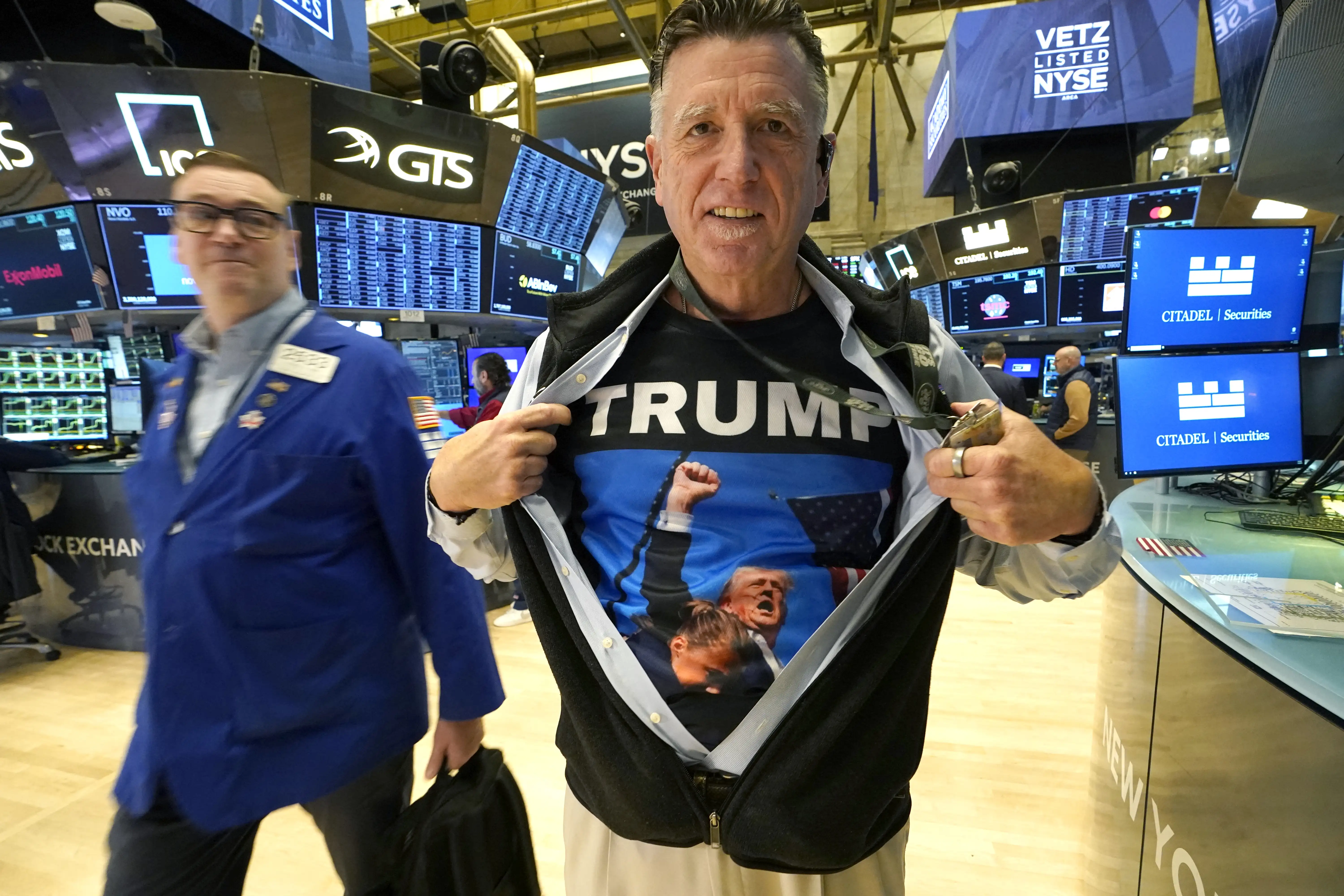 A trader shows off his shirt featuring US President-elect Donald Trump, on the floor of the New York Stock Exchange