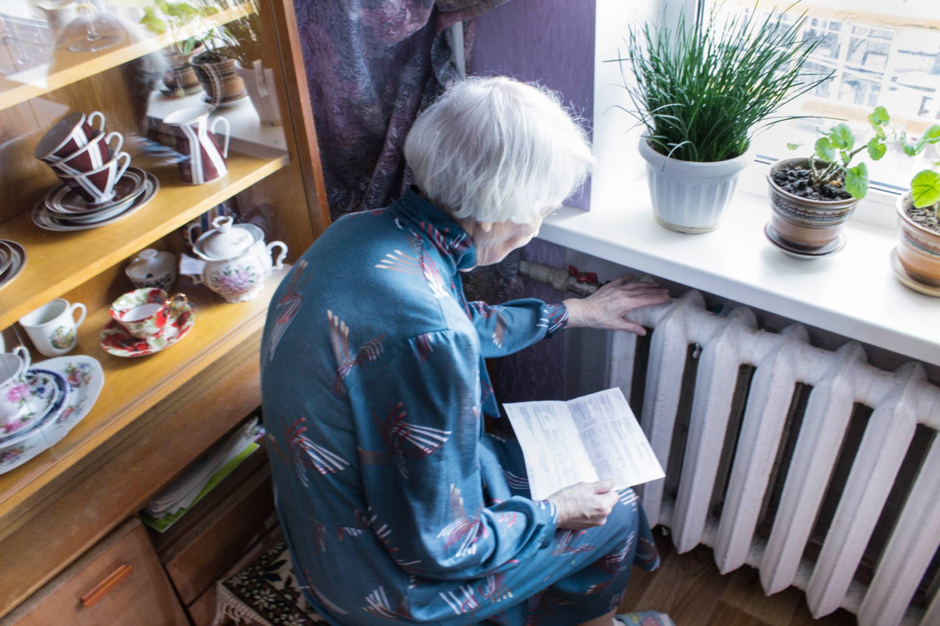 Older Lady Hand On Heater