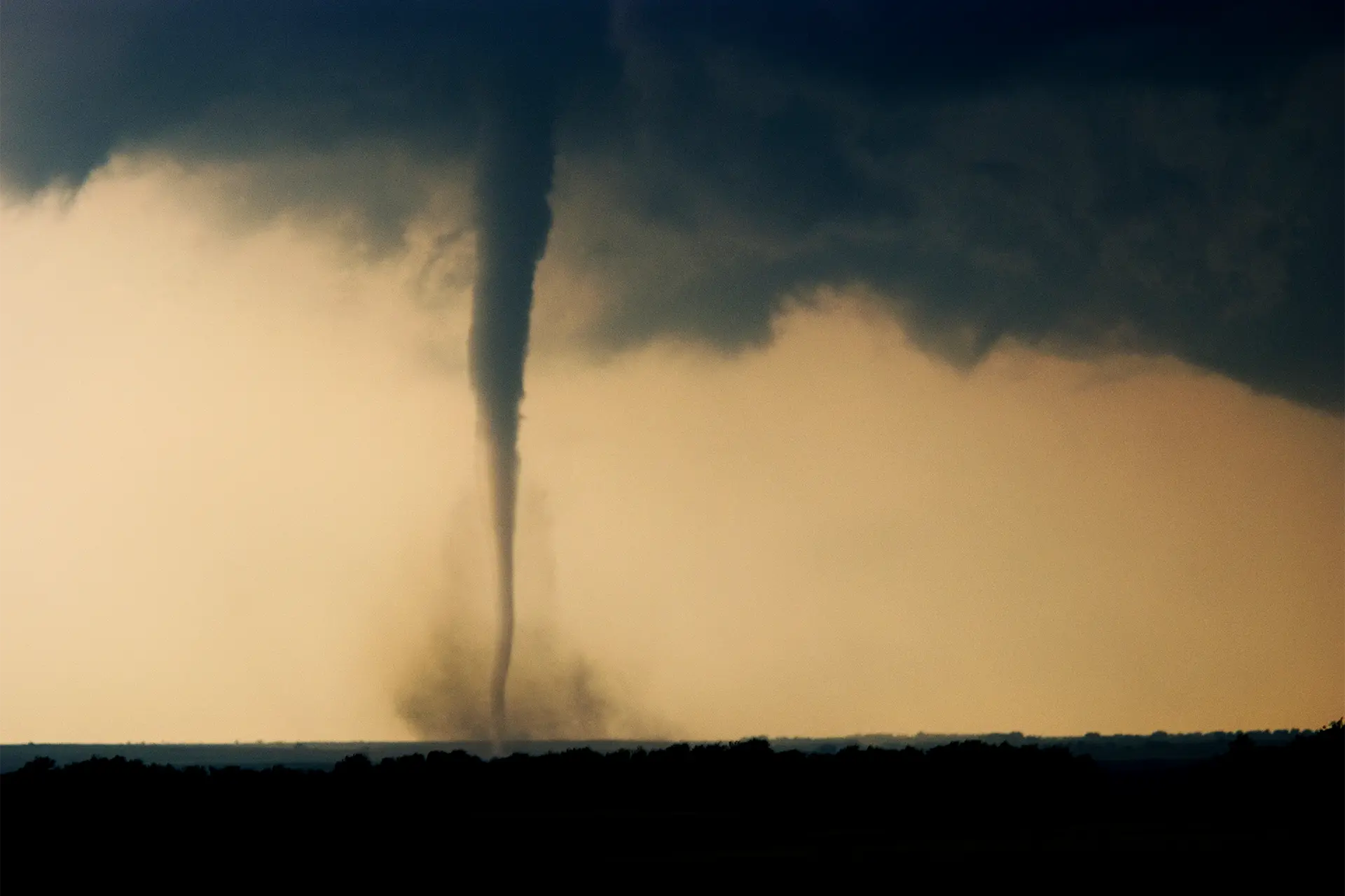 A tornado on a dark landscape