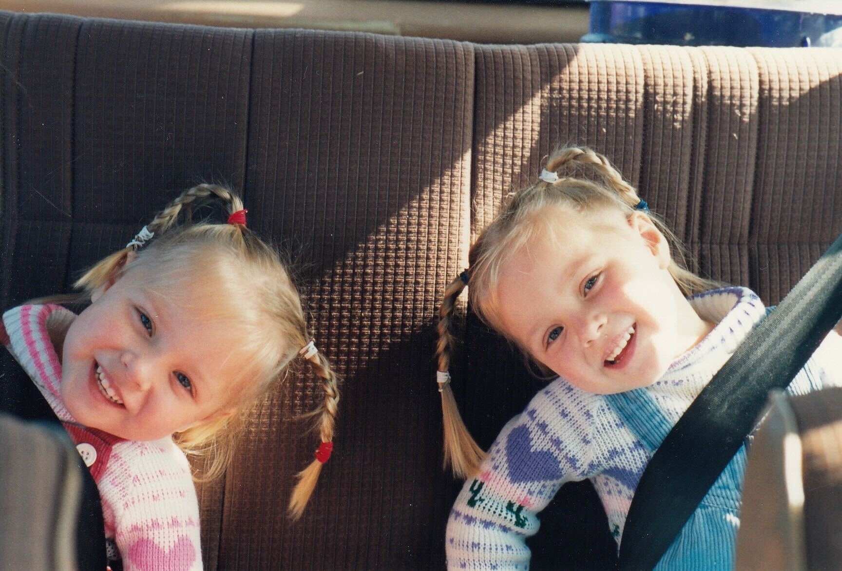 Twin girls in car