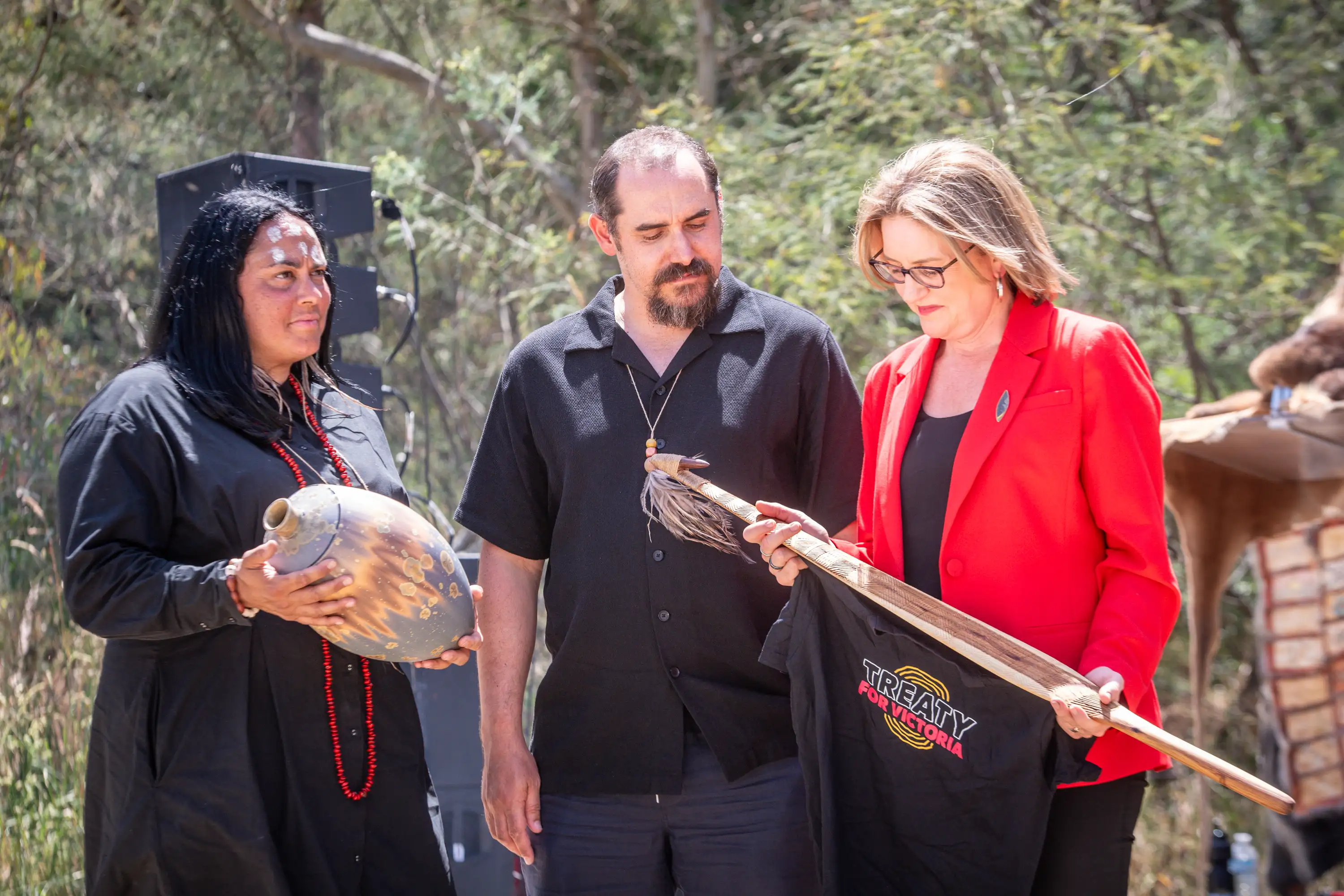 Co-chairs of the First Peoples’ Assembly of Victoria, Ngarra Murray and Ruben Berg, exchange gifts with Premier Jacinta Allan.