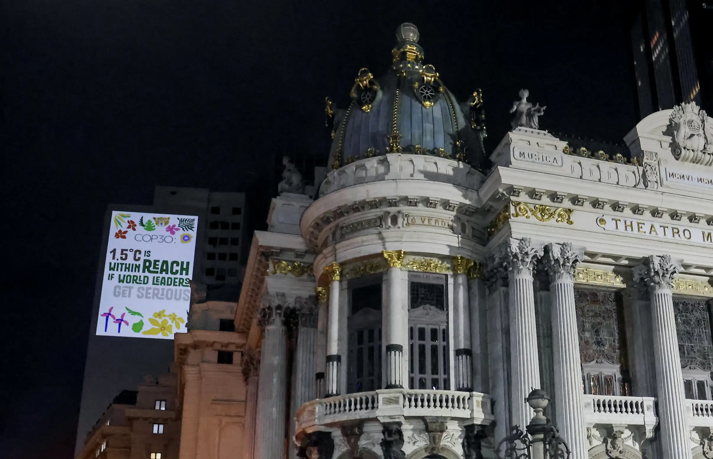 Environmental activists in Brazil project images onto a building demanding action against climate change.