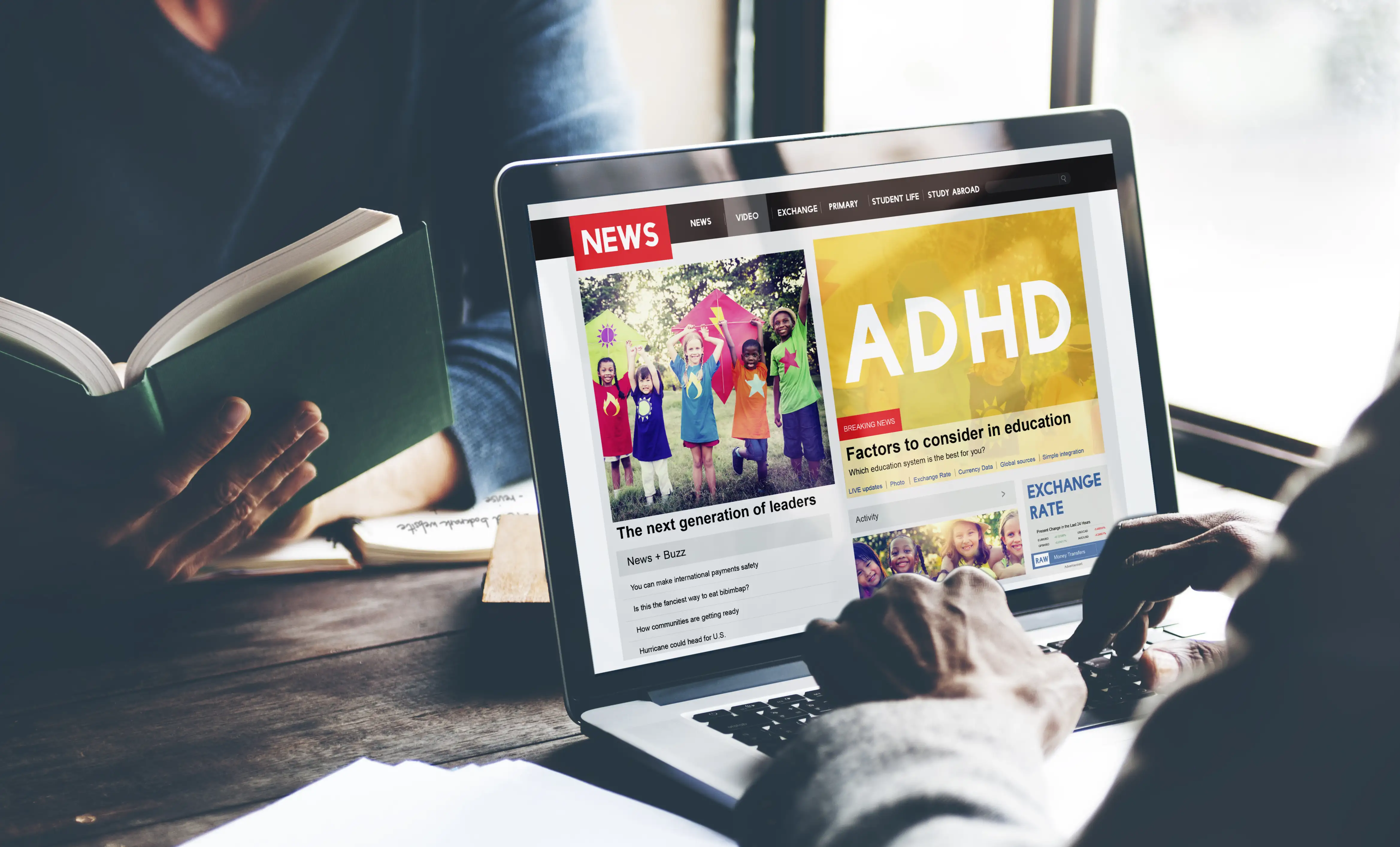 A person on a laptop reading a headline about ADHD