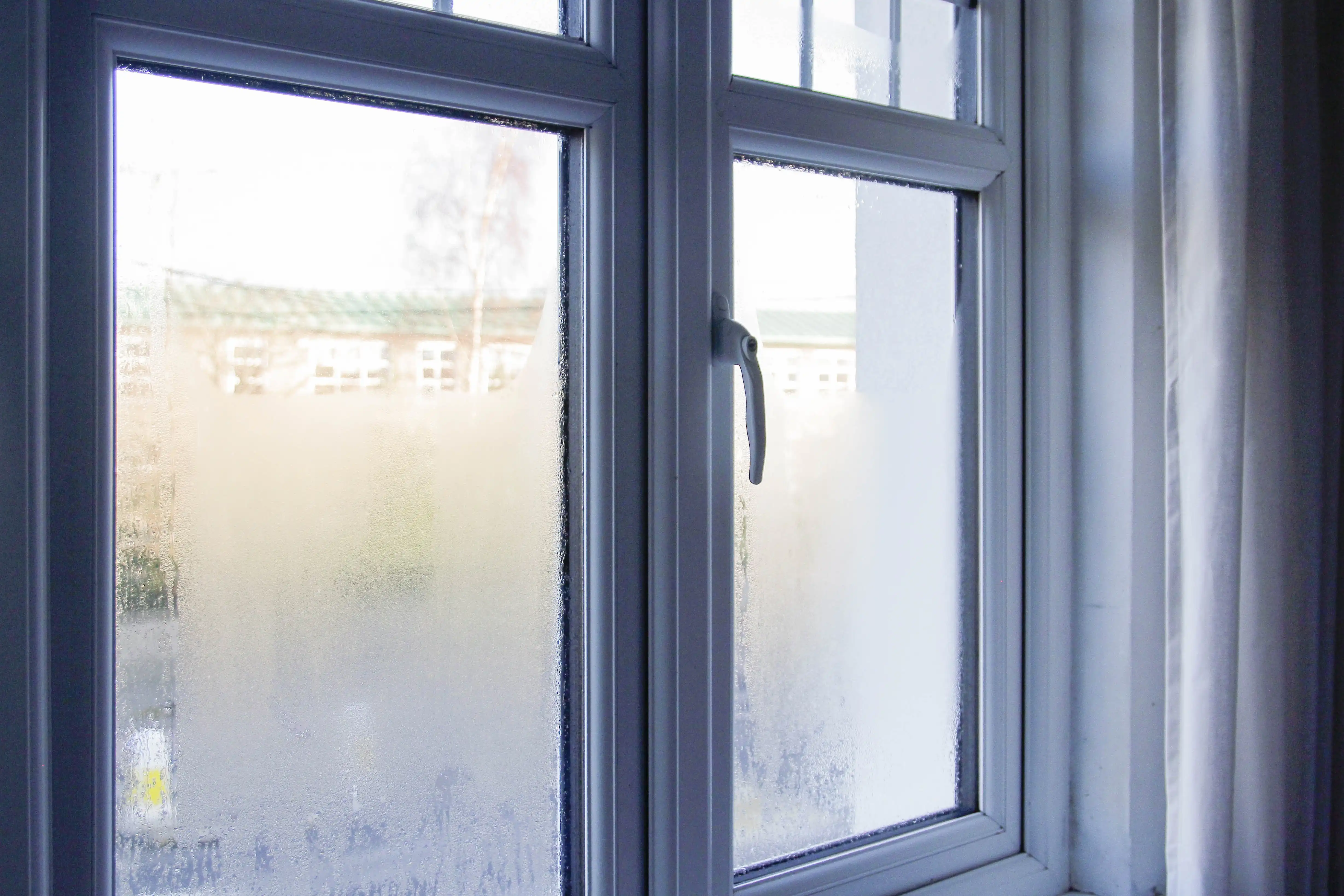 A steamy window from a warm home in the middle of winter