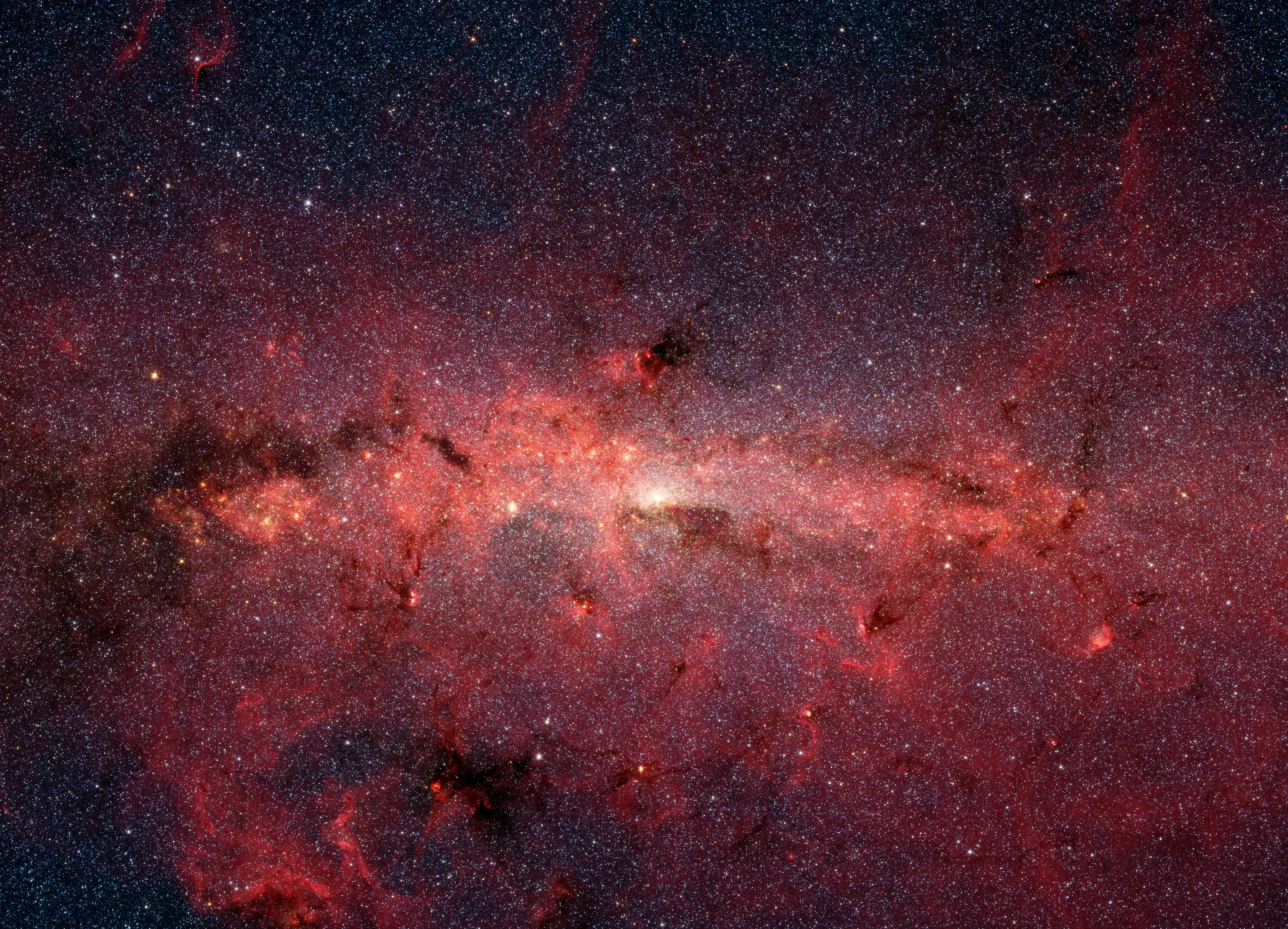 Infrared image from NASA Spitzer Space Telescope shows hundreds of thousands of stars crowded into the swirling core of our spiral Milky Way galaxy