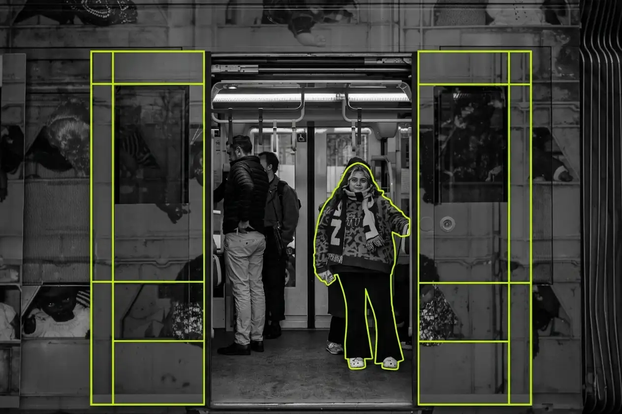 A black-and-white photo of a woman on a Melbourne tram outlined in lime green
