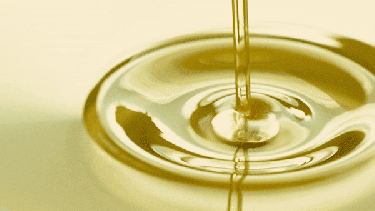 A GIF of olive oil splashing as it's being poured