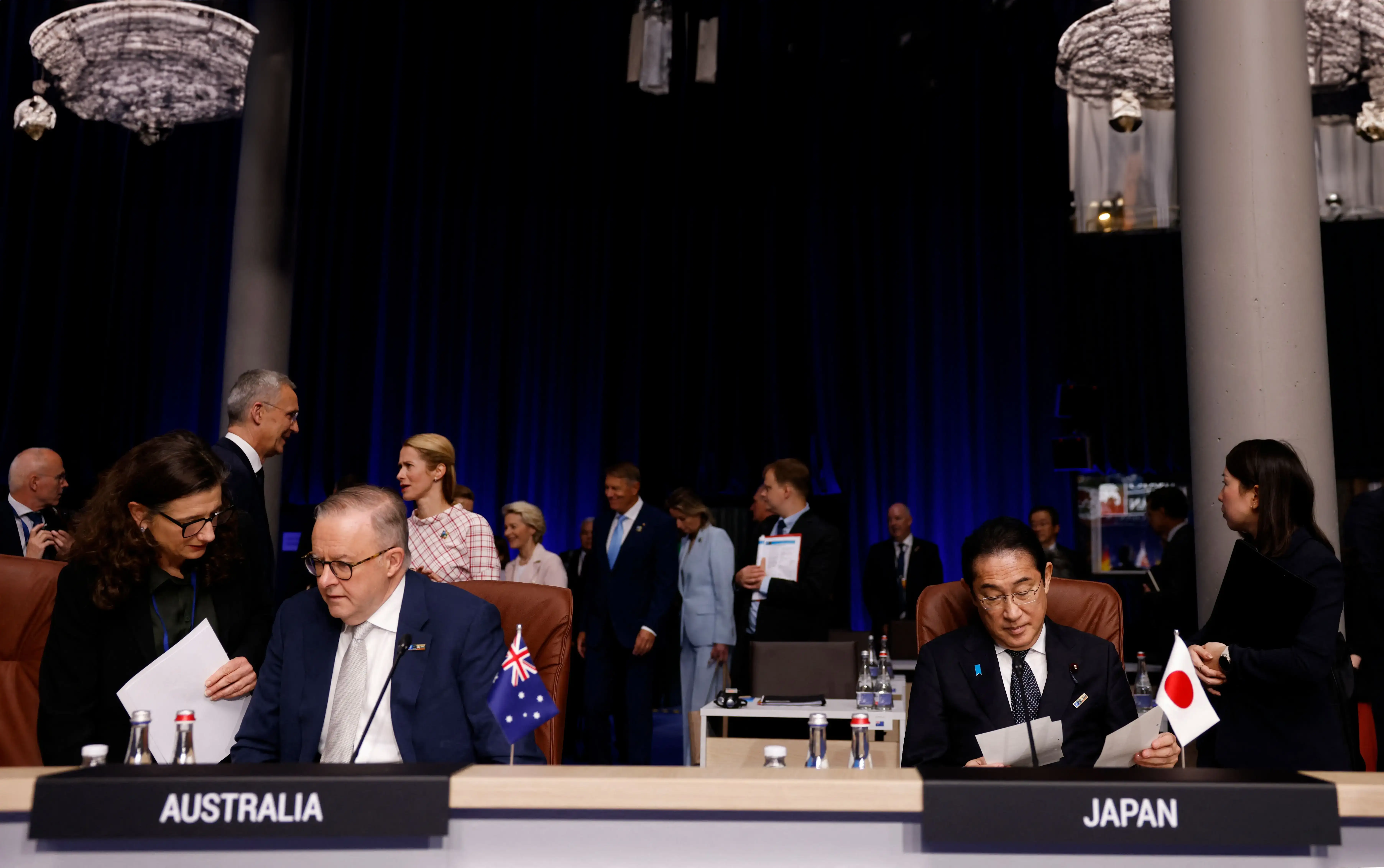 Australia's Prime Minister Anthony Albanese (L) sits next to Japan's Prime Minister Fumio Kishida 