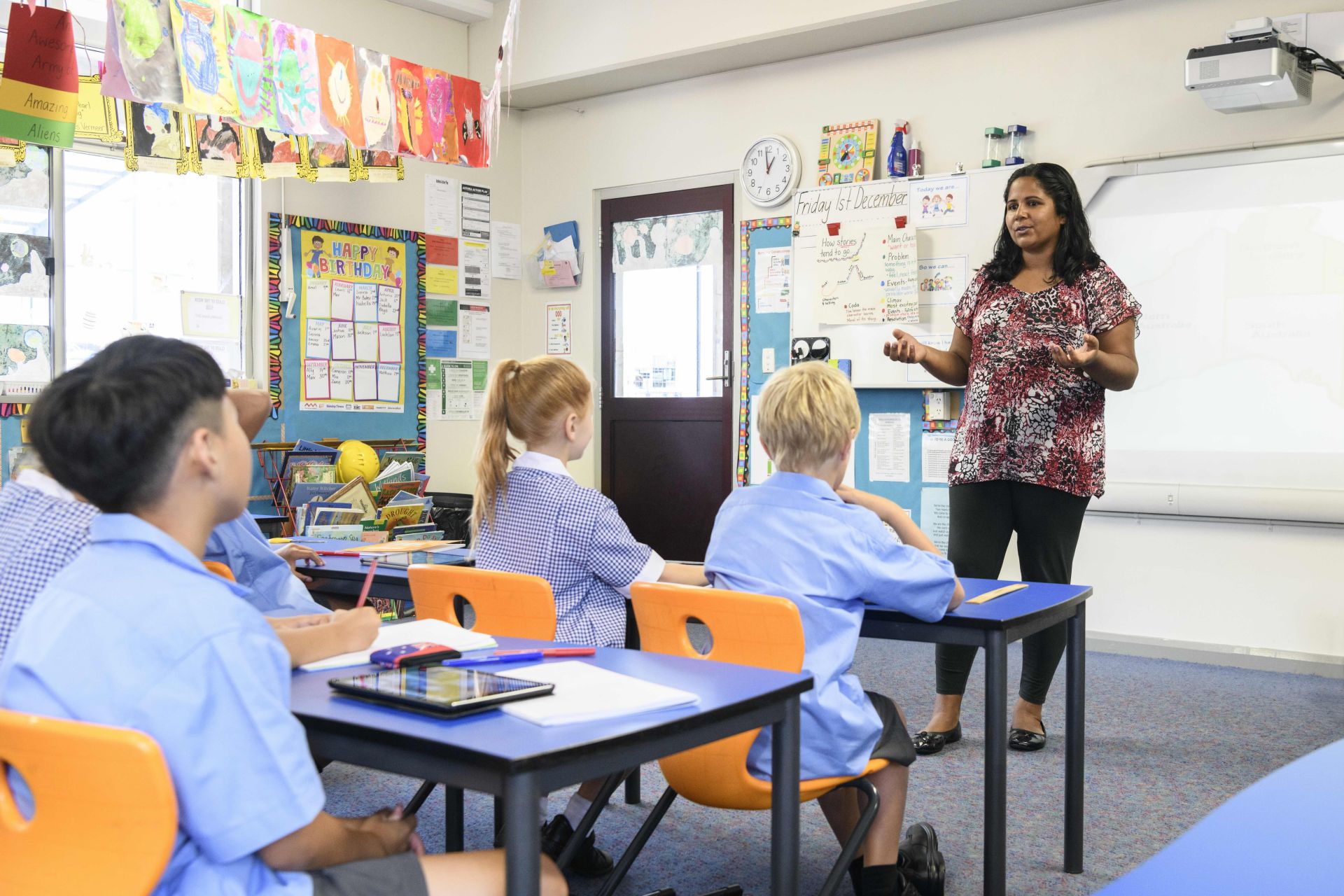 Female teacher in front of class