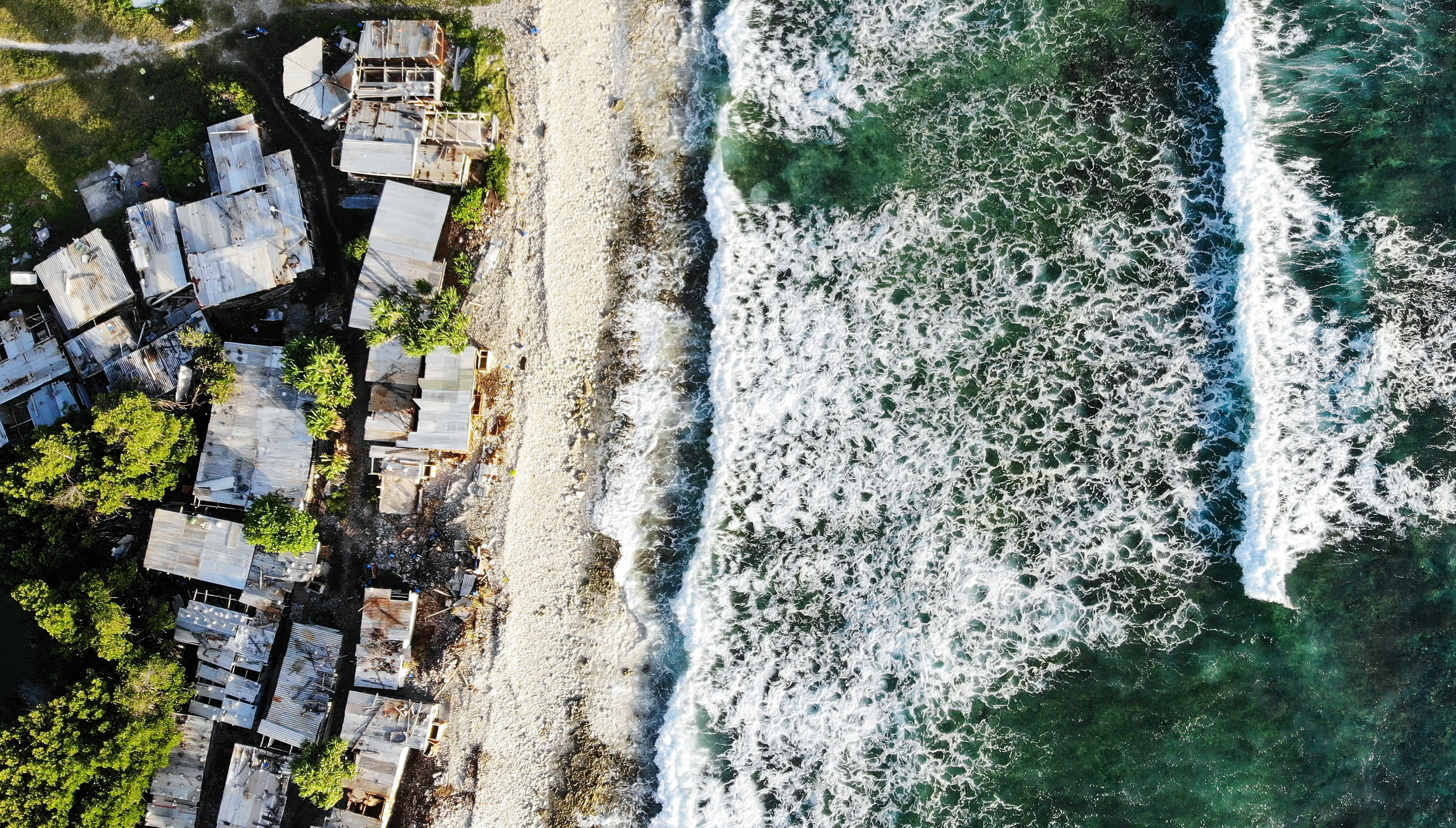 An aerial view of rising sea levels threatening the coral atoll nation of Tuvalu.