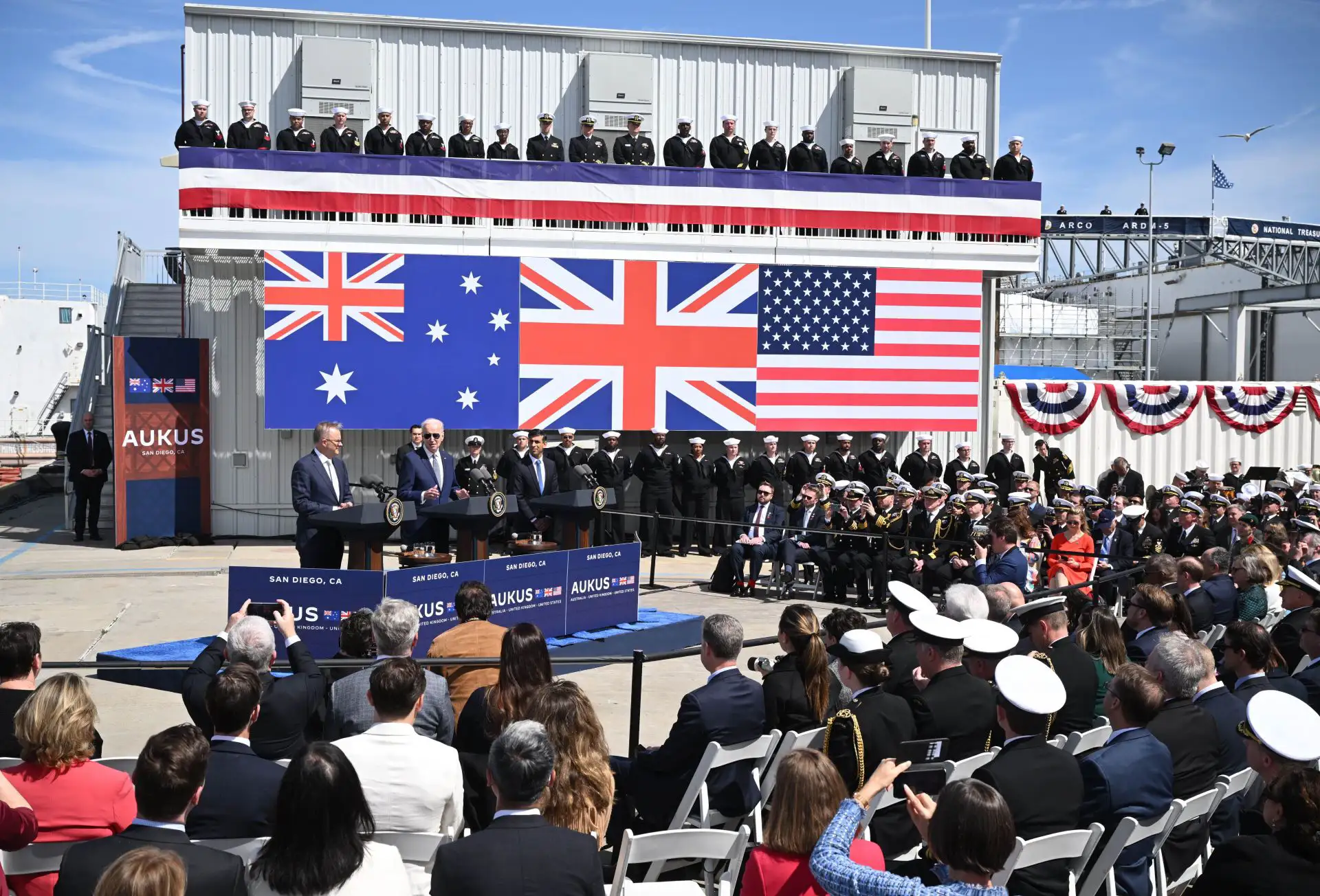 Anthony Albanese, Joe Biden and Rishi Sunak at an AUKUS event on a naval ship.