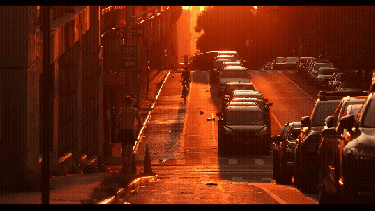 A busy hot street at sunset
