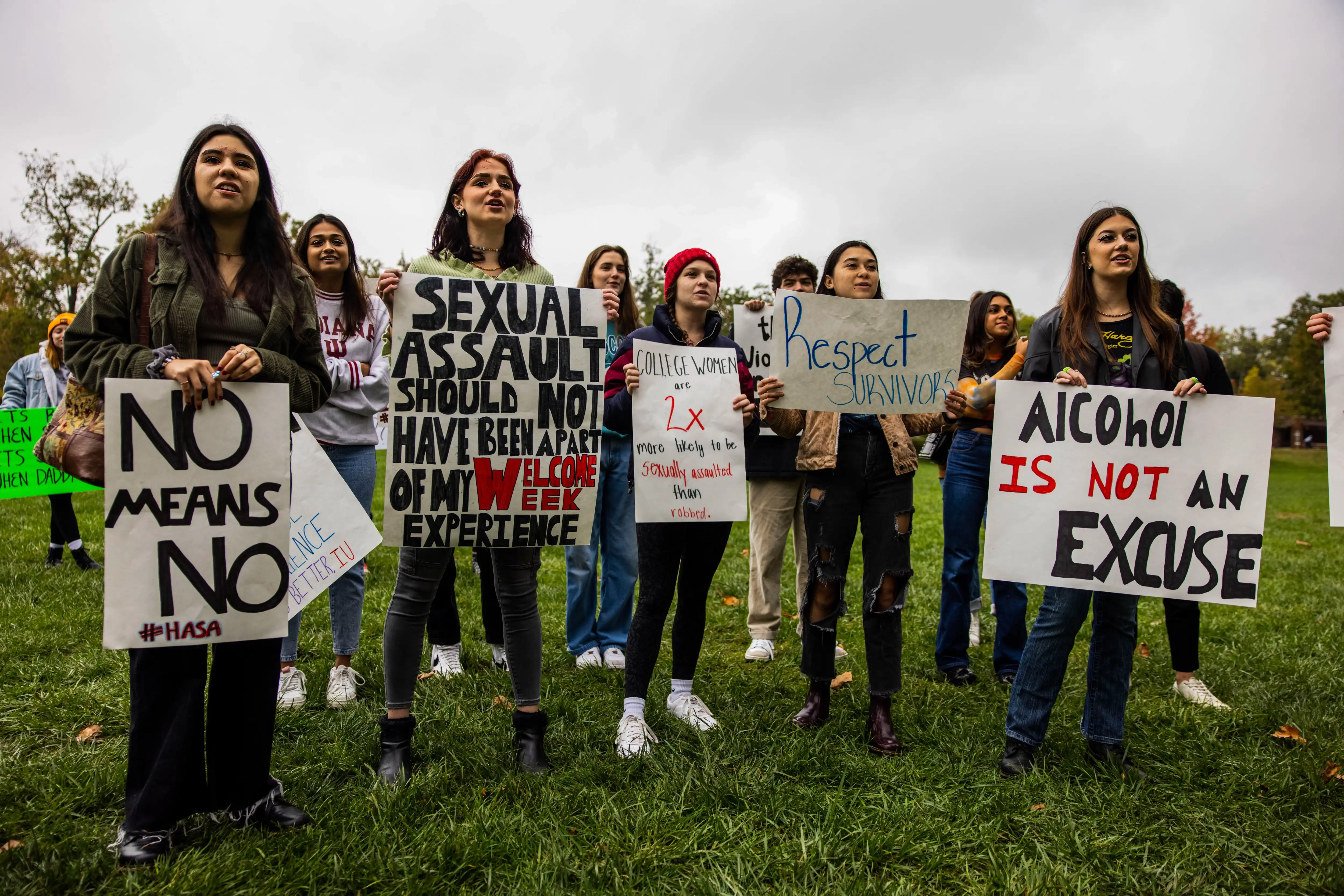 Students holding posters in a protest against sexual violence at their university in the USA