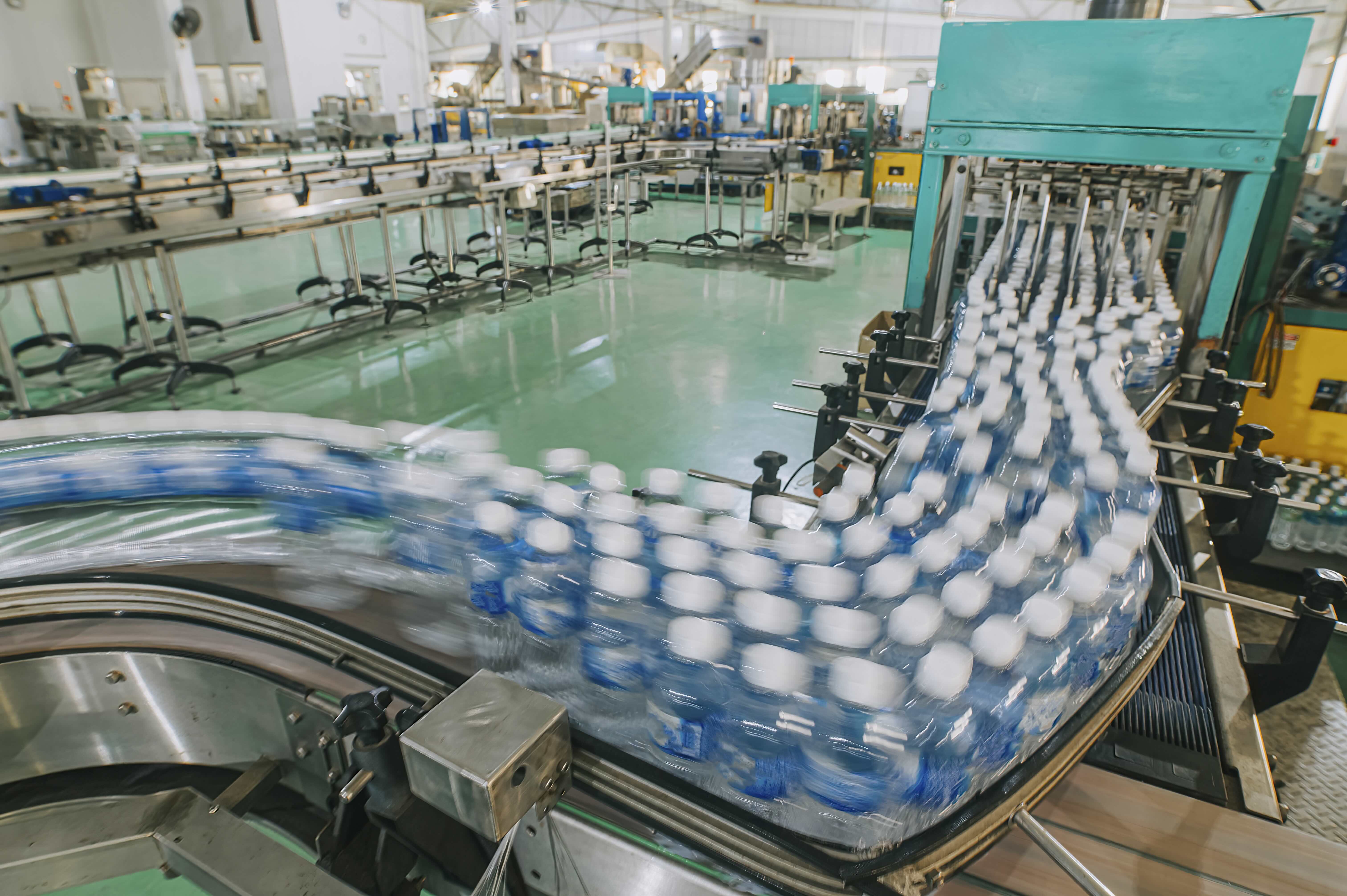 Plastic water bottles at mineral water factory production line