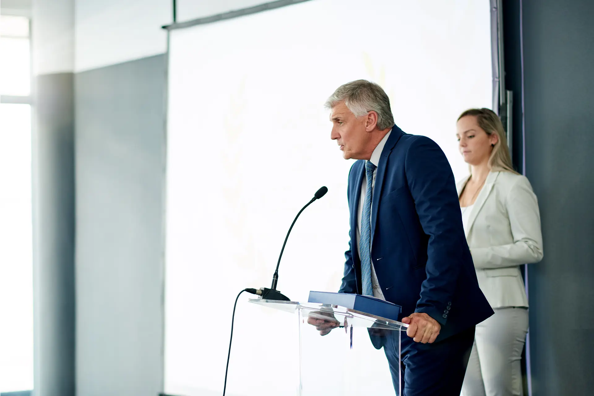 Business man speaking at a lectern