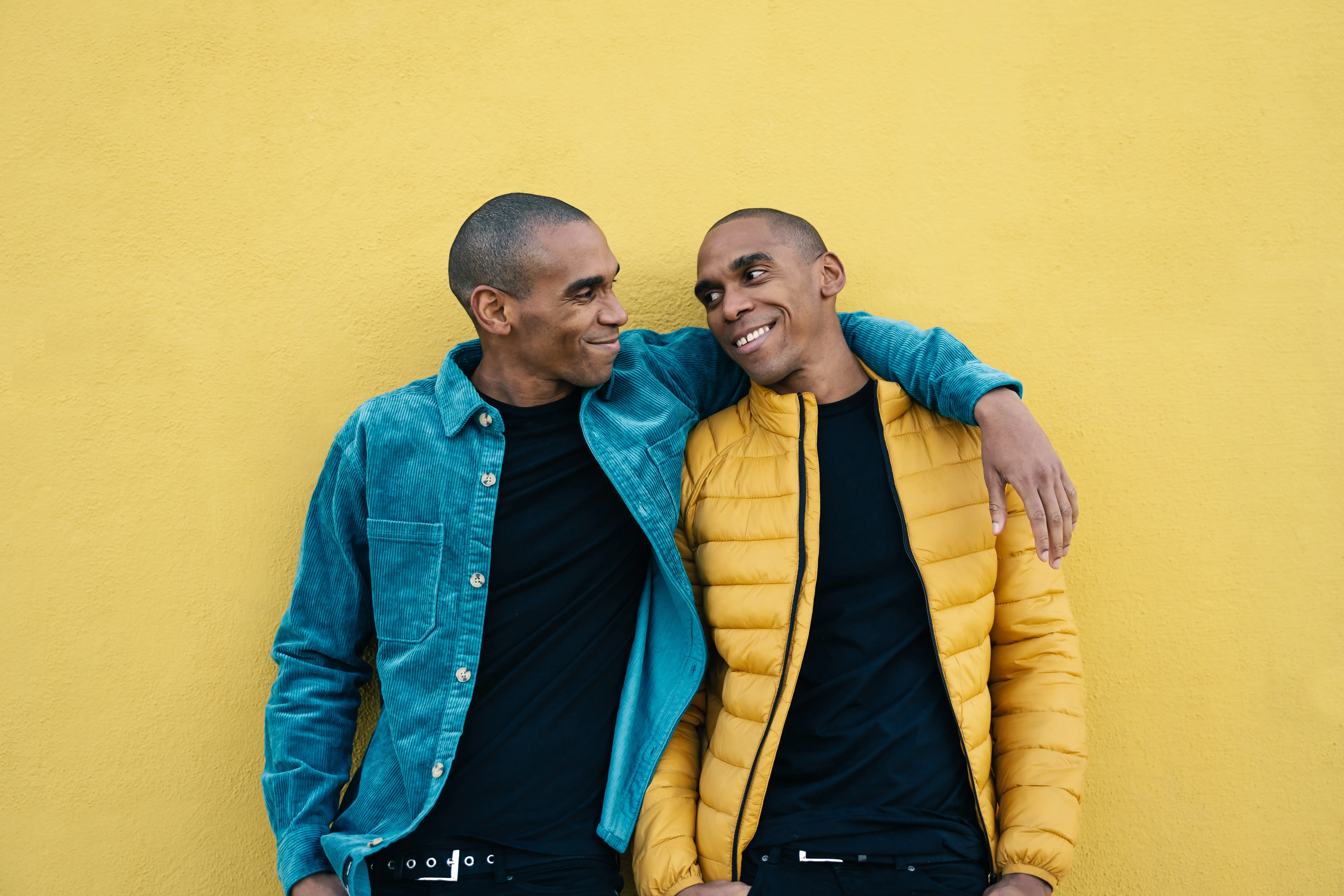 Two laughing grown up male twins