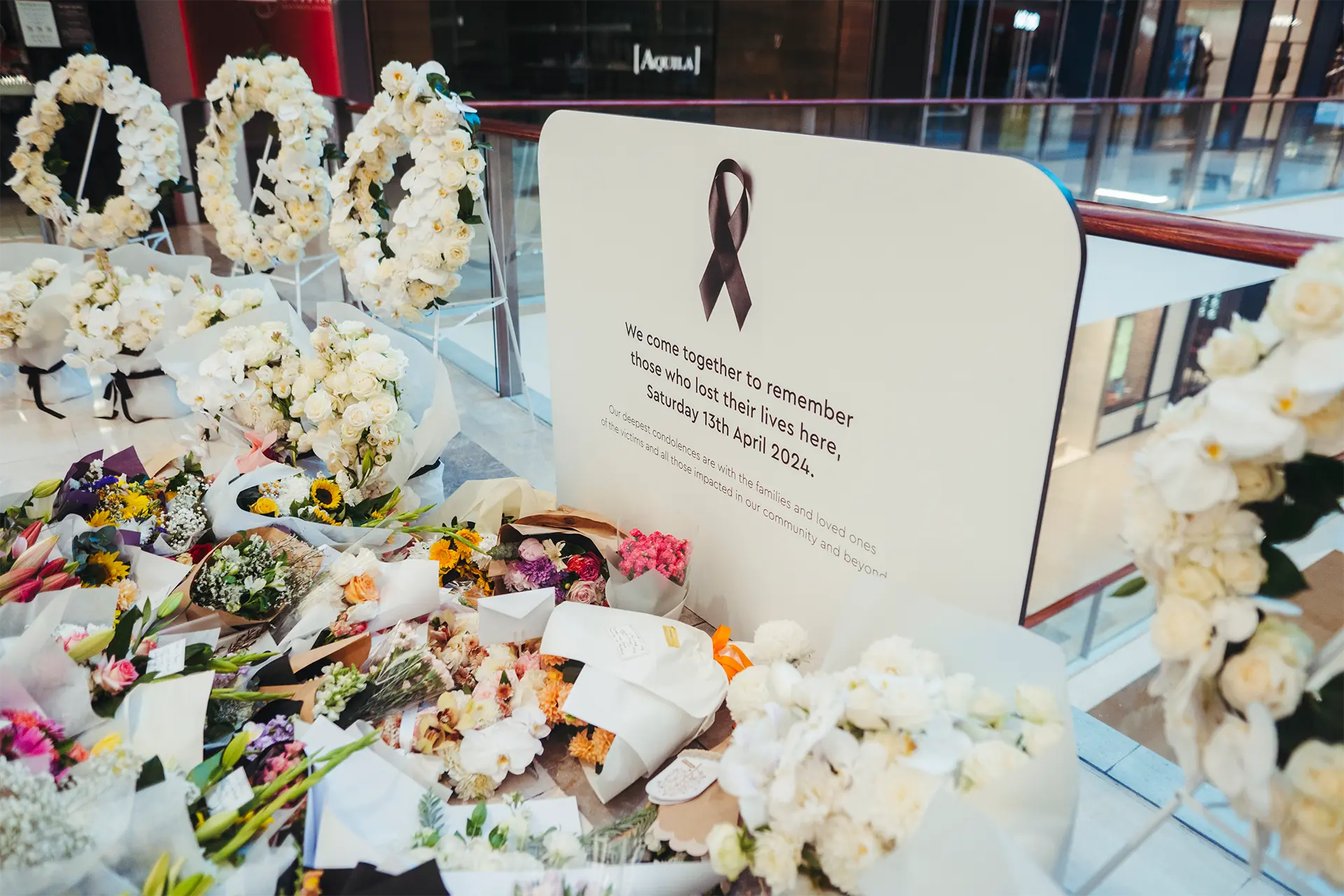 Flowers at a make-shift memorial in Bondi Junction shopping centre
