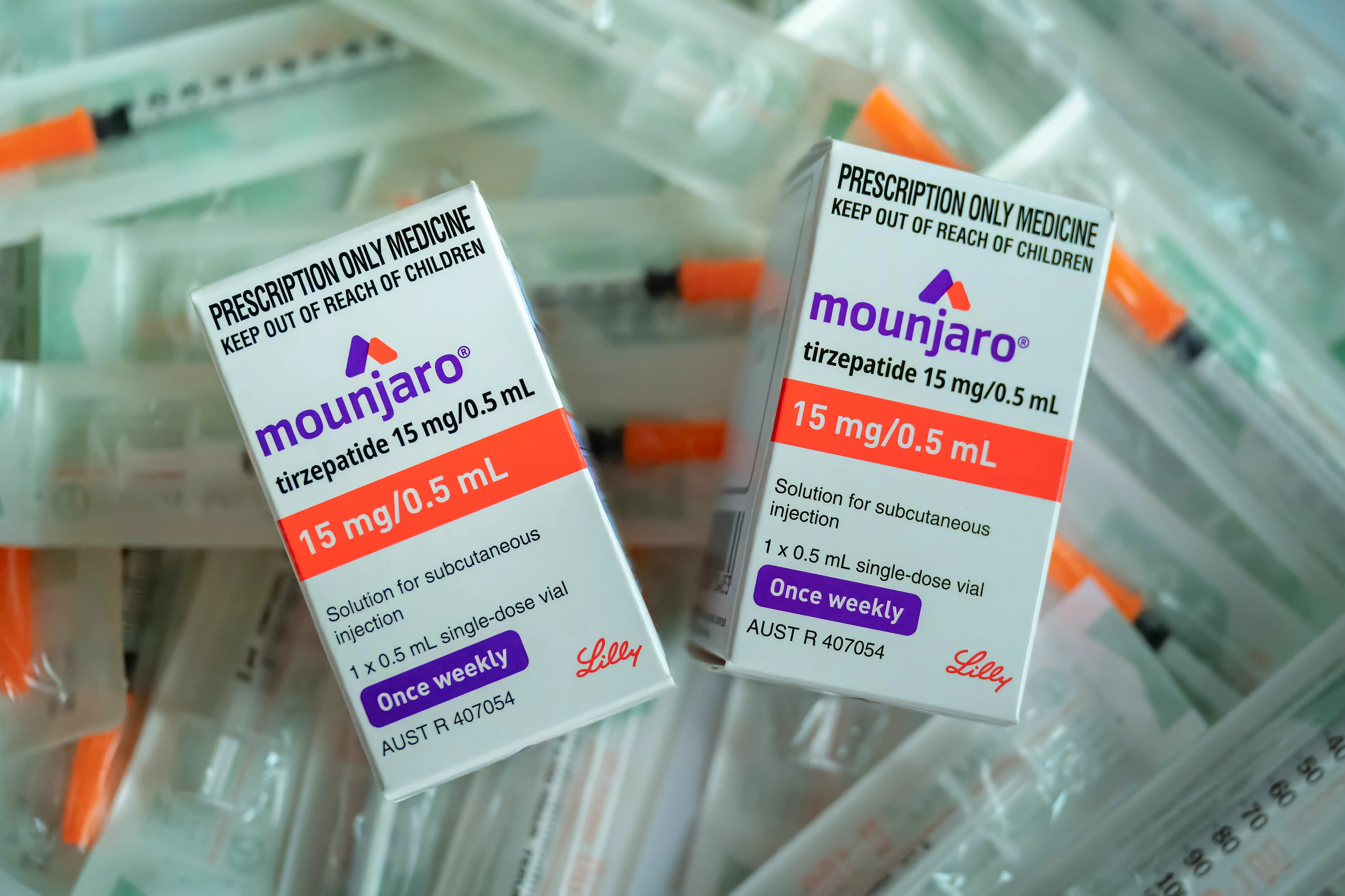 Mounjaro tirzepatide GLP-1 GIP receptor agonist in a pile of boxes.