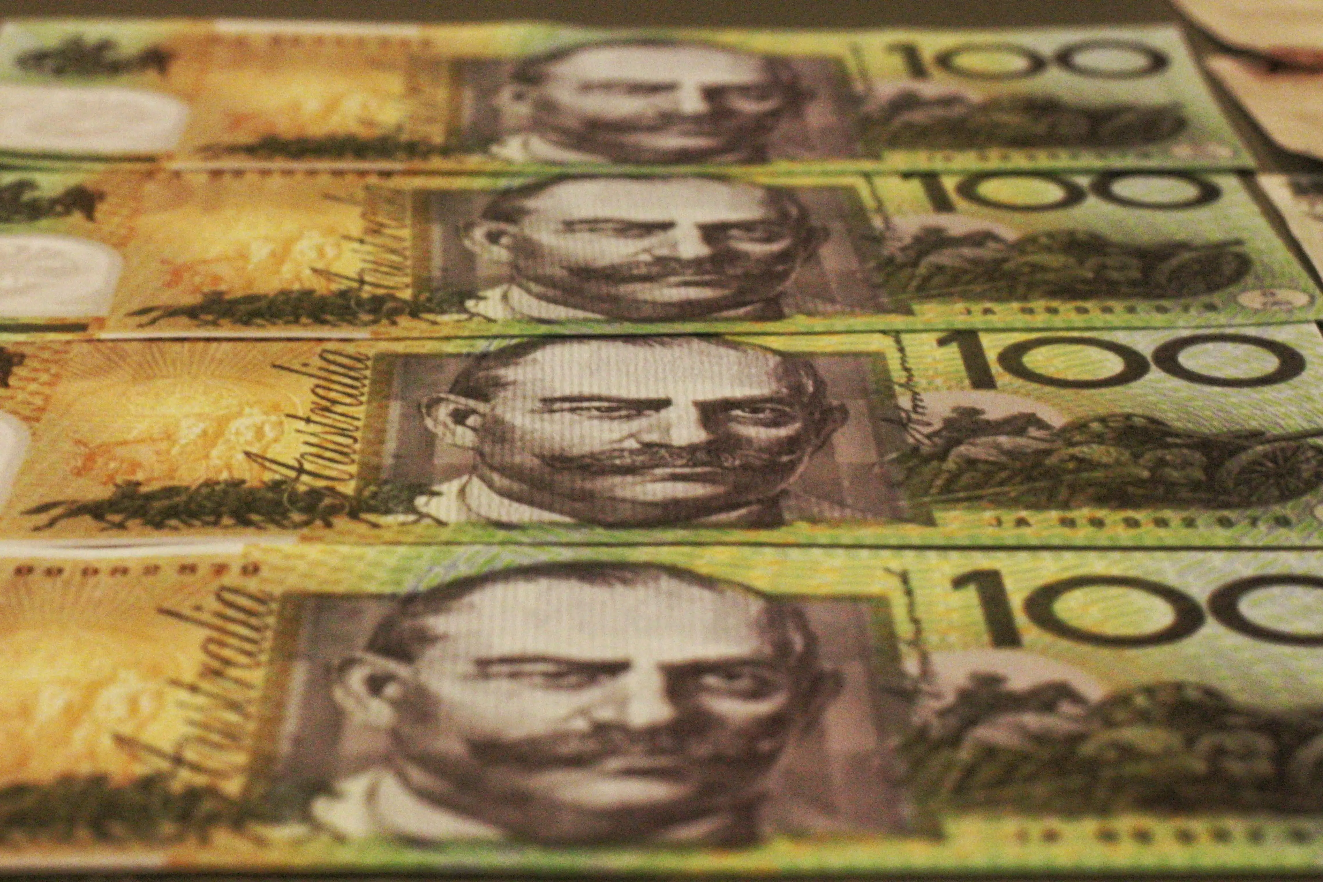 A close-up of Australian one hundred dollar notes
