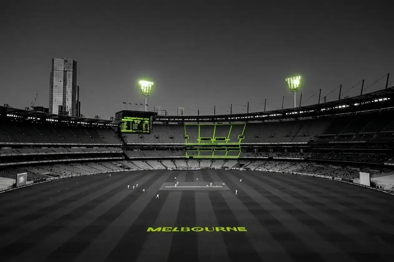 A black-and-white photo of Melbourne's MCG outlined in lime green