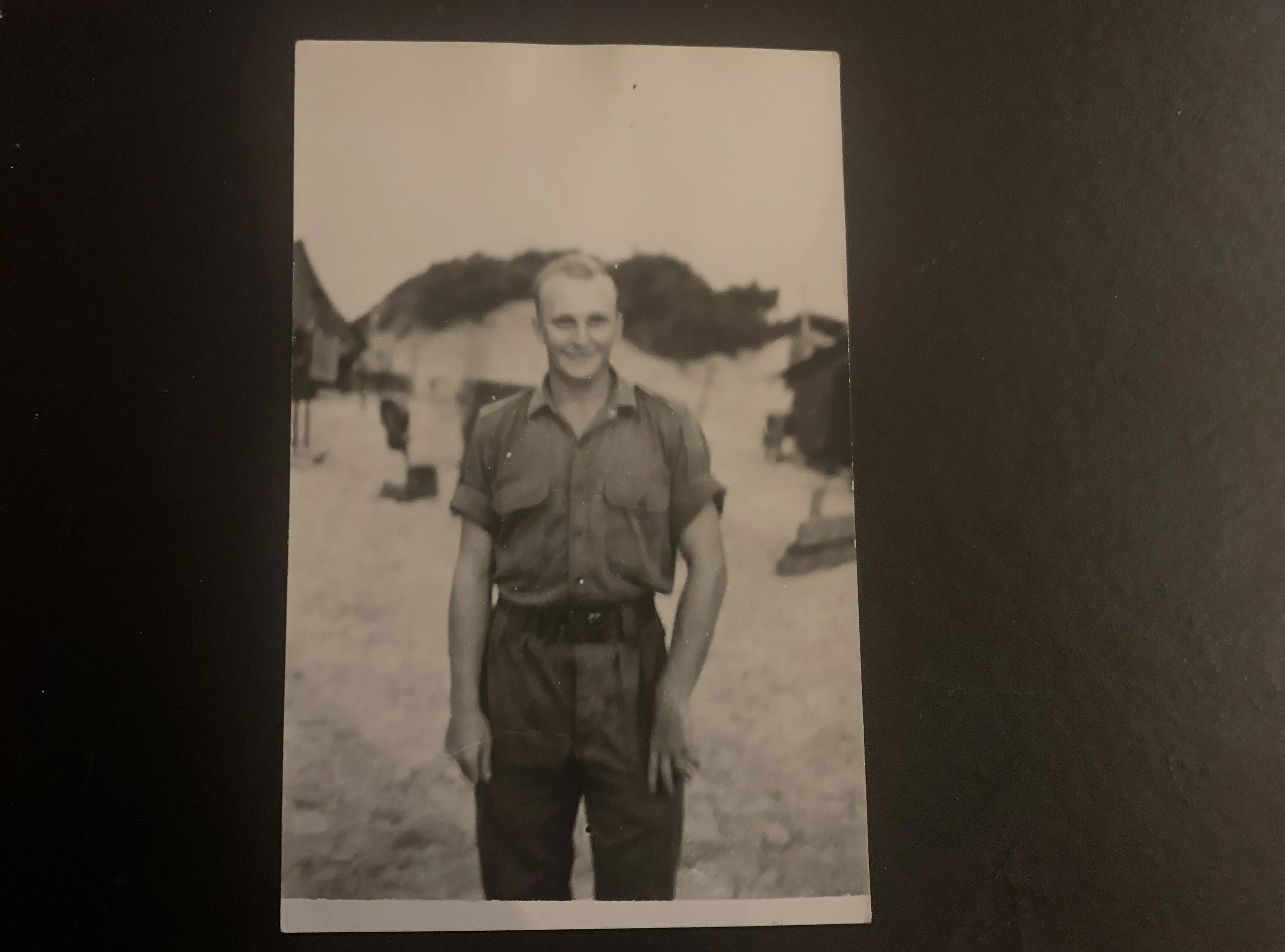 A black-and-white photo of the author's father in military uniform