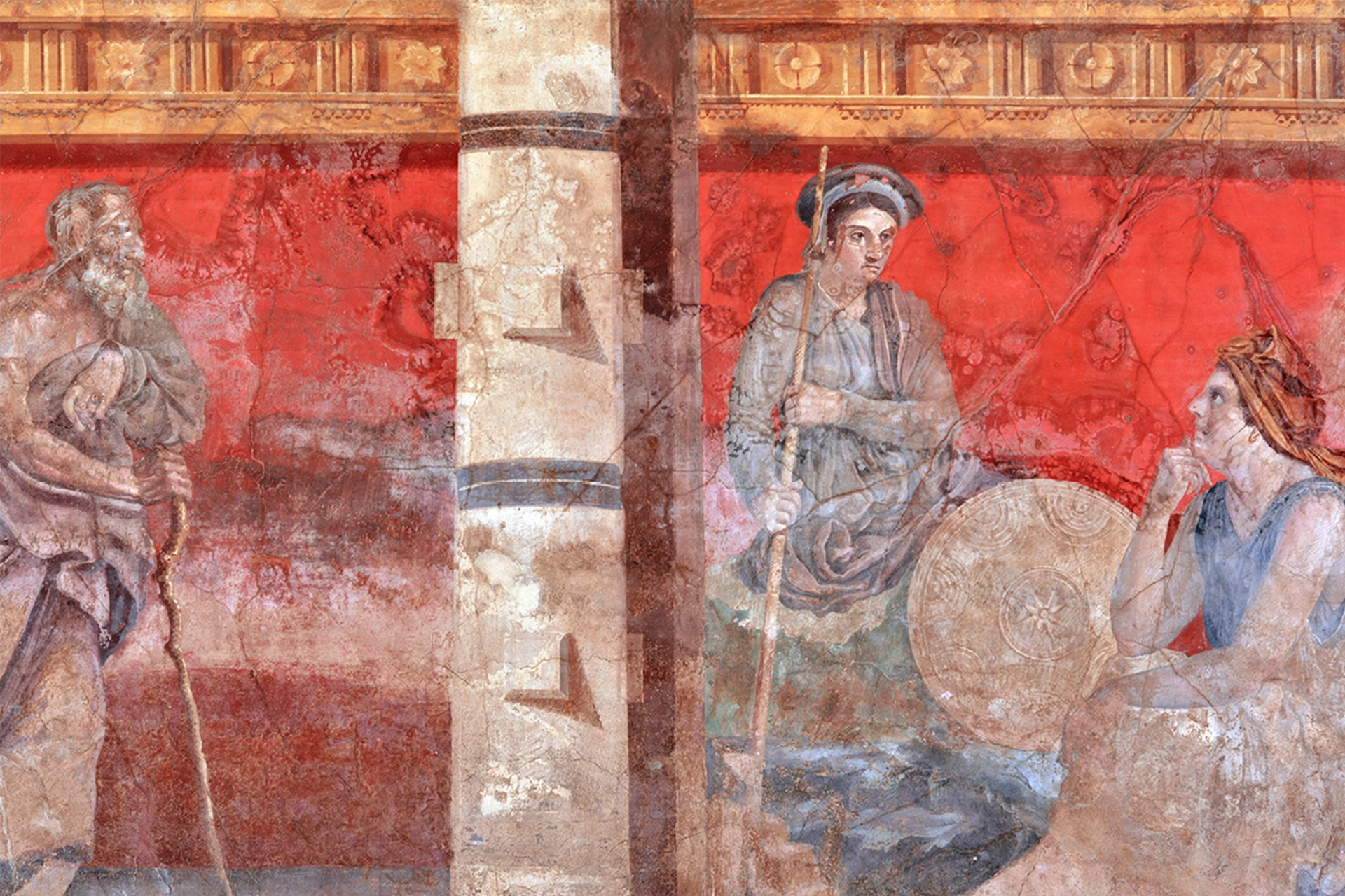 Two young ancient figures sitting alongside an older man, looking contemplative against red background