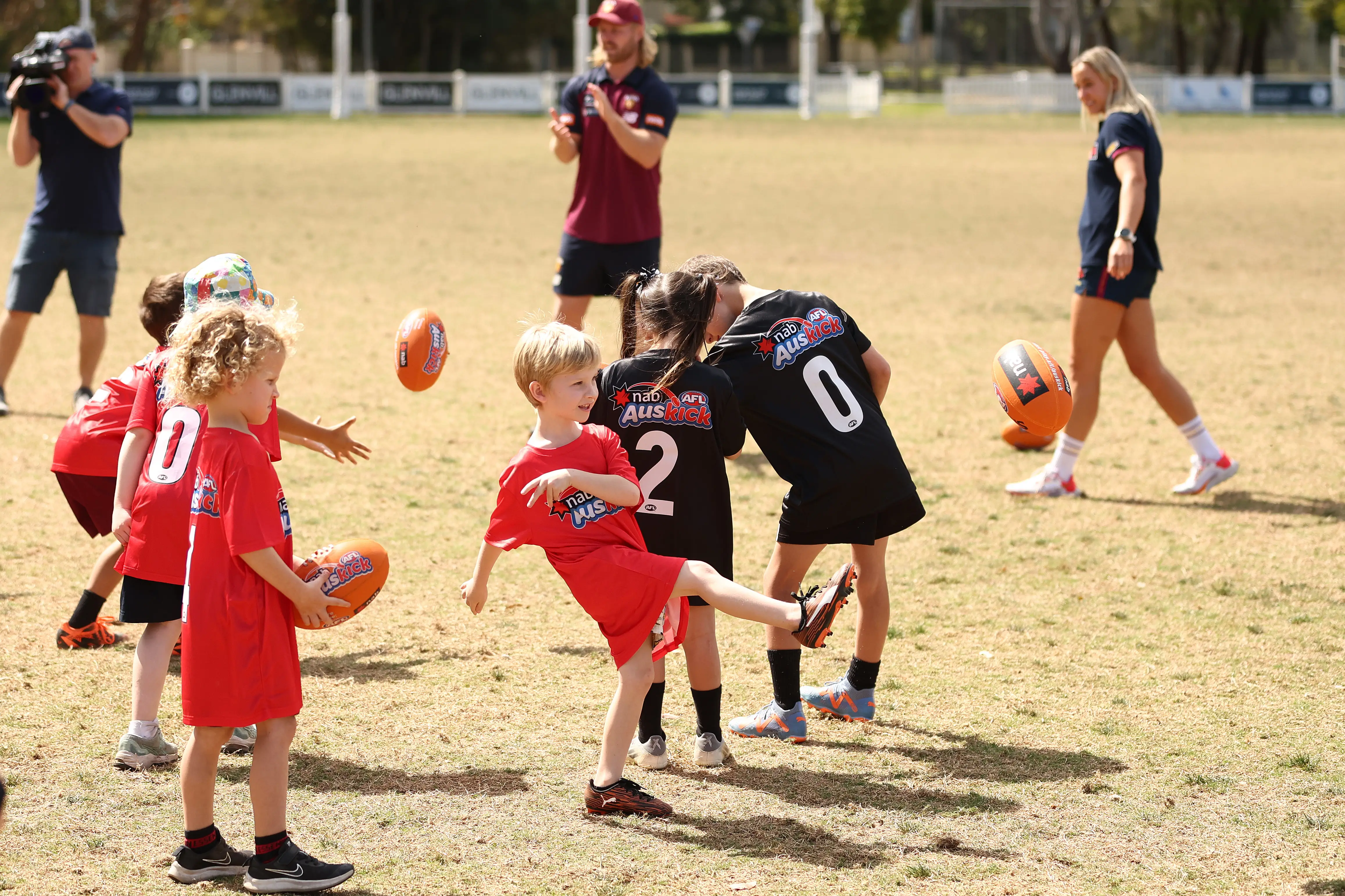 Kids taking part in an Auskick event 