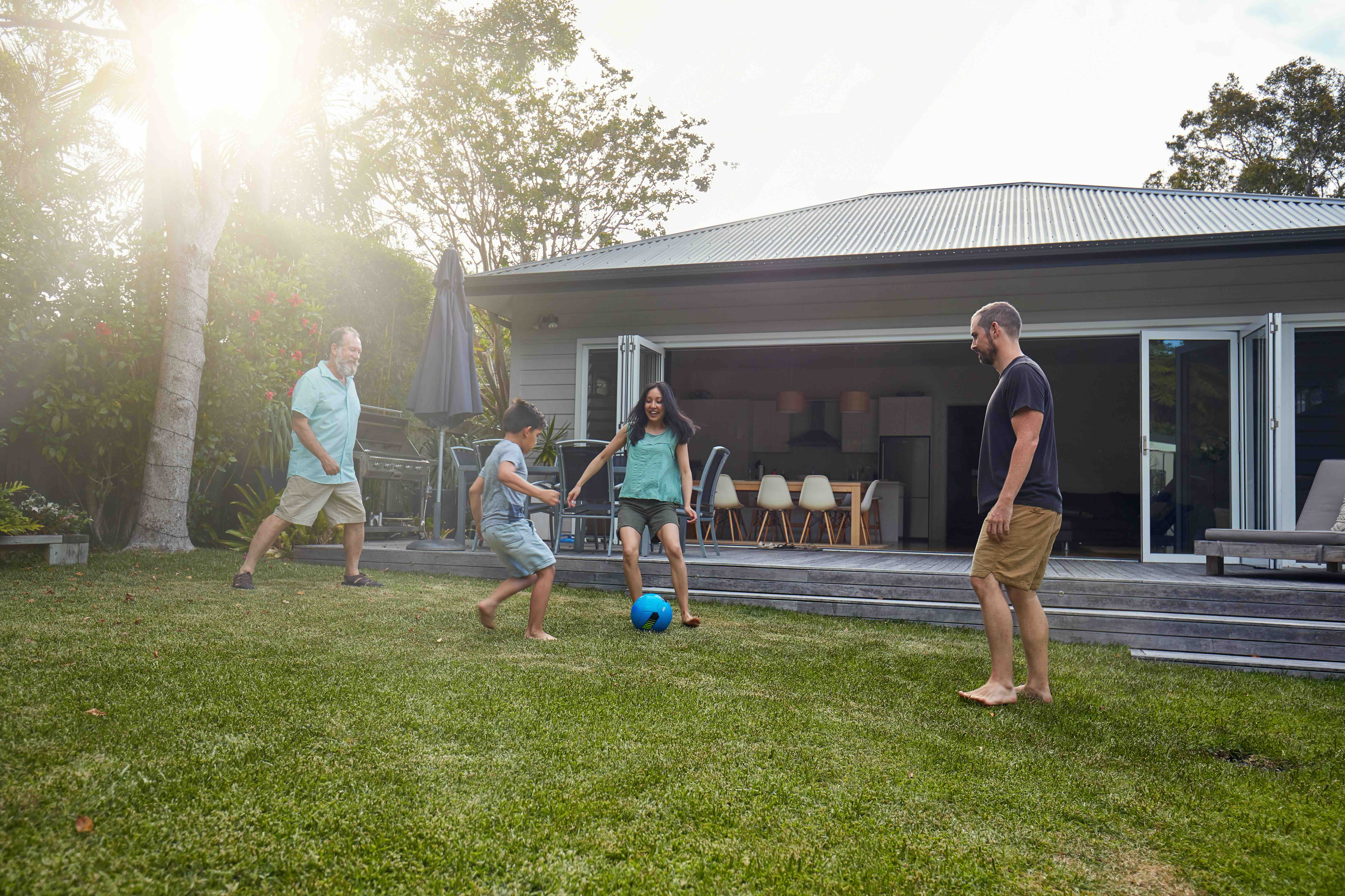 Family soccer in backyard