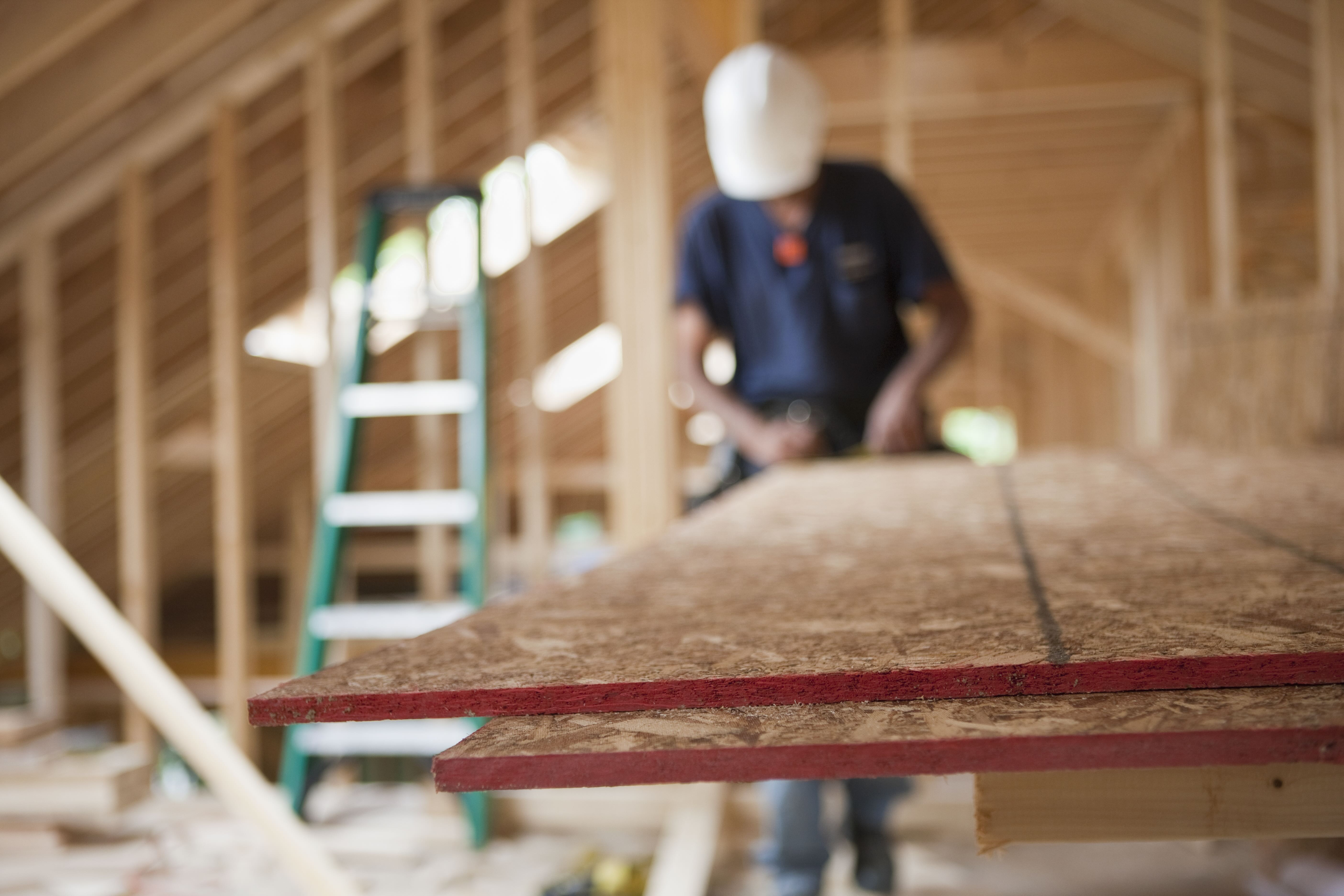 Builders working on a house