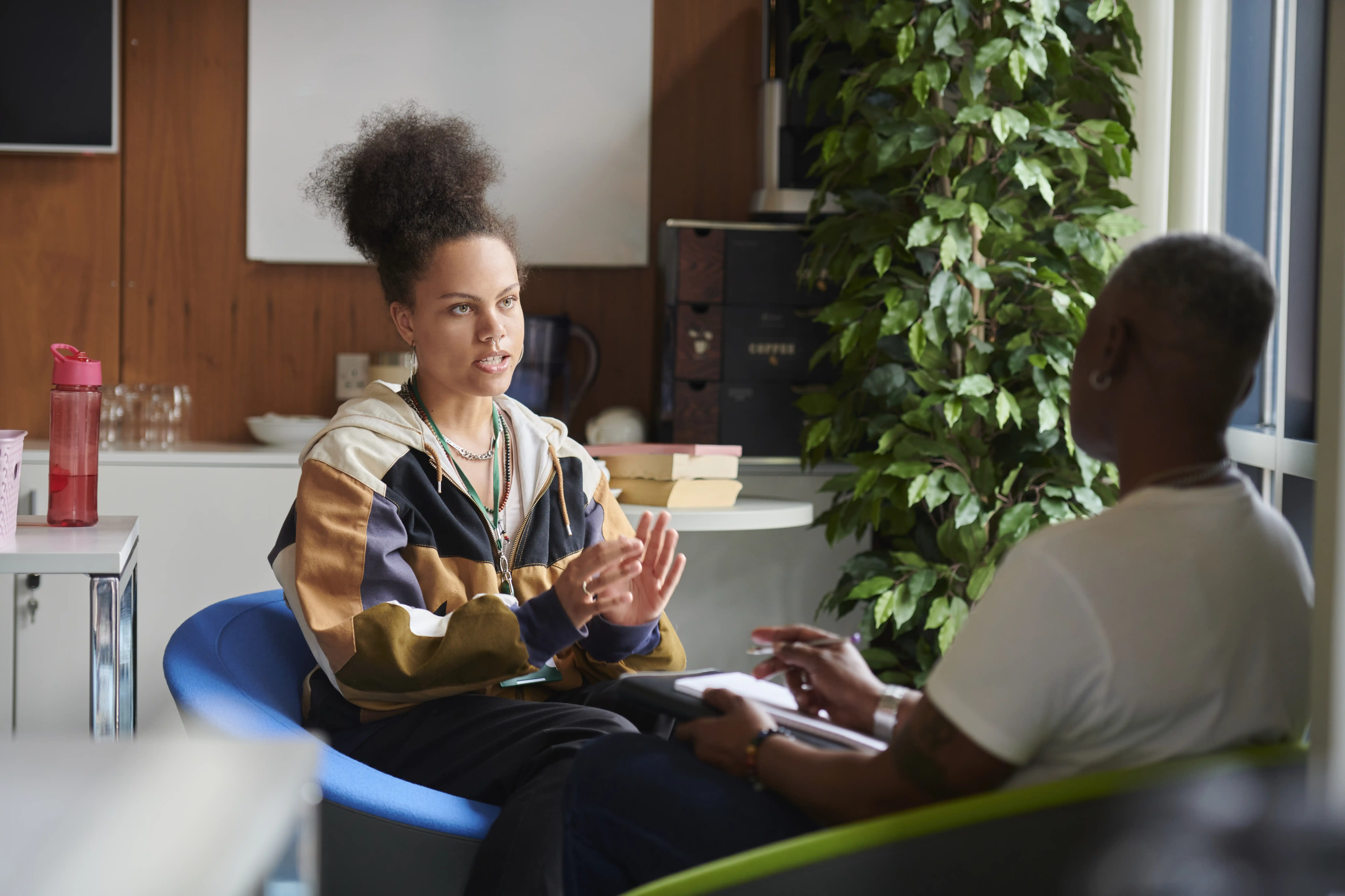 A woman speaks with a counsellor