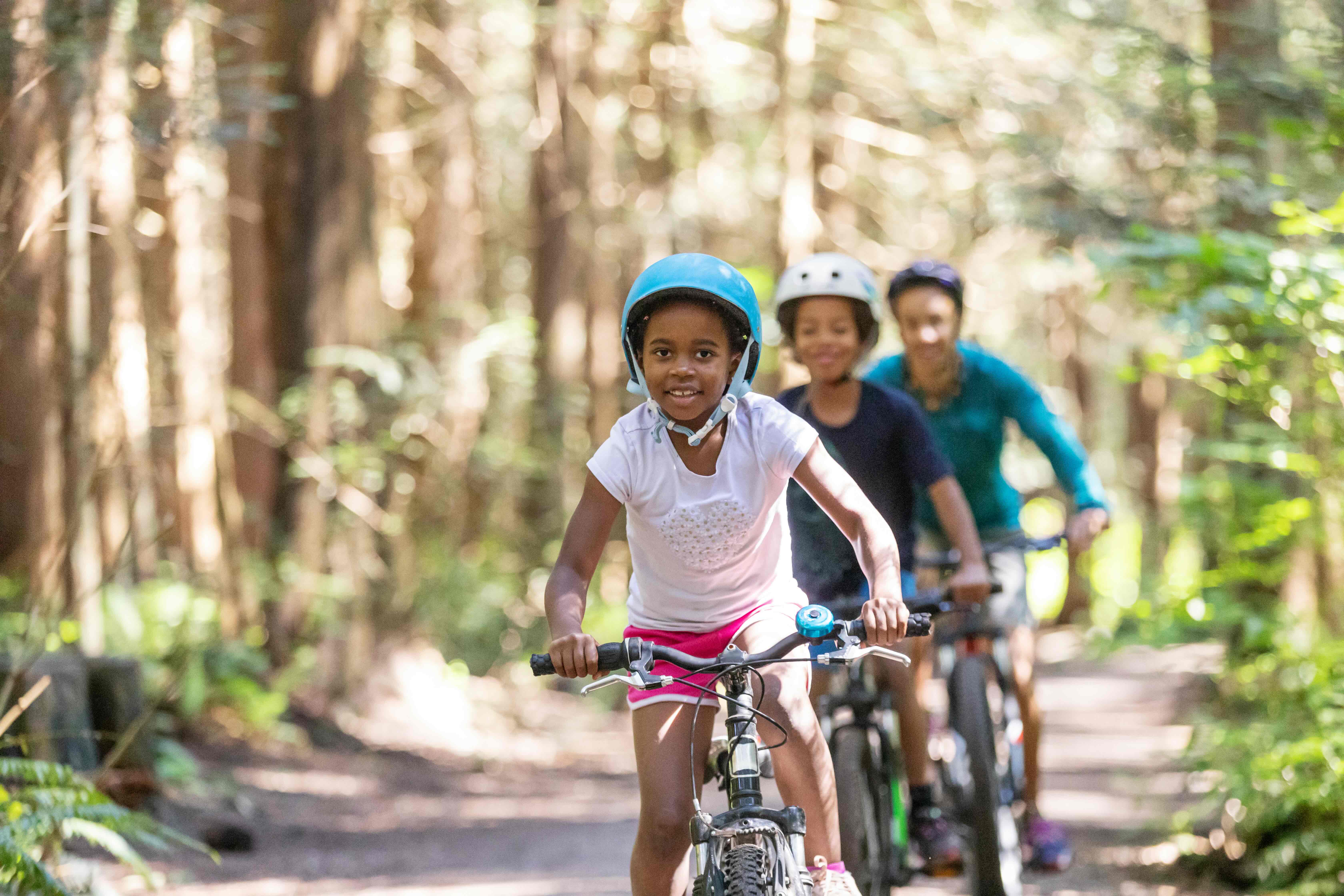Young Kids Biking in Forest