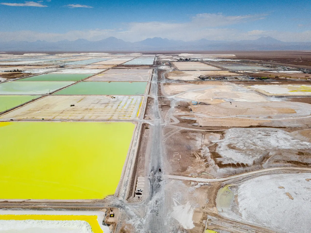 A large lithium mine with yellow and green brine pools
