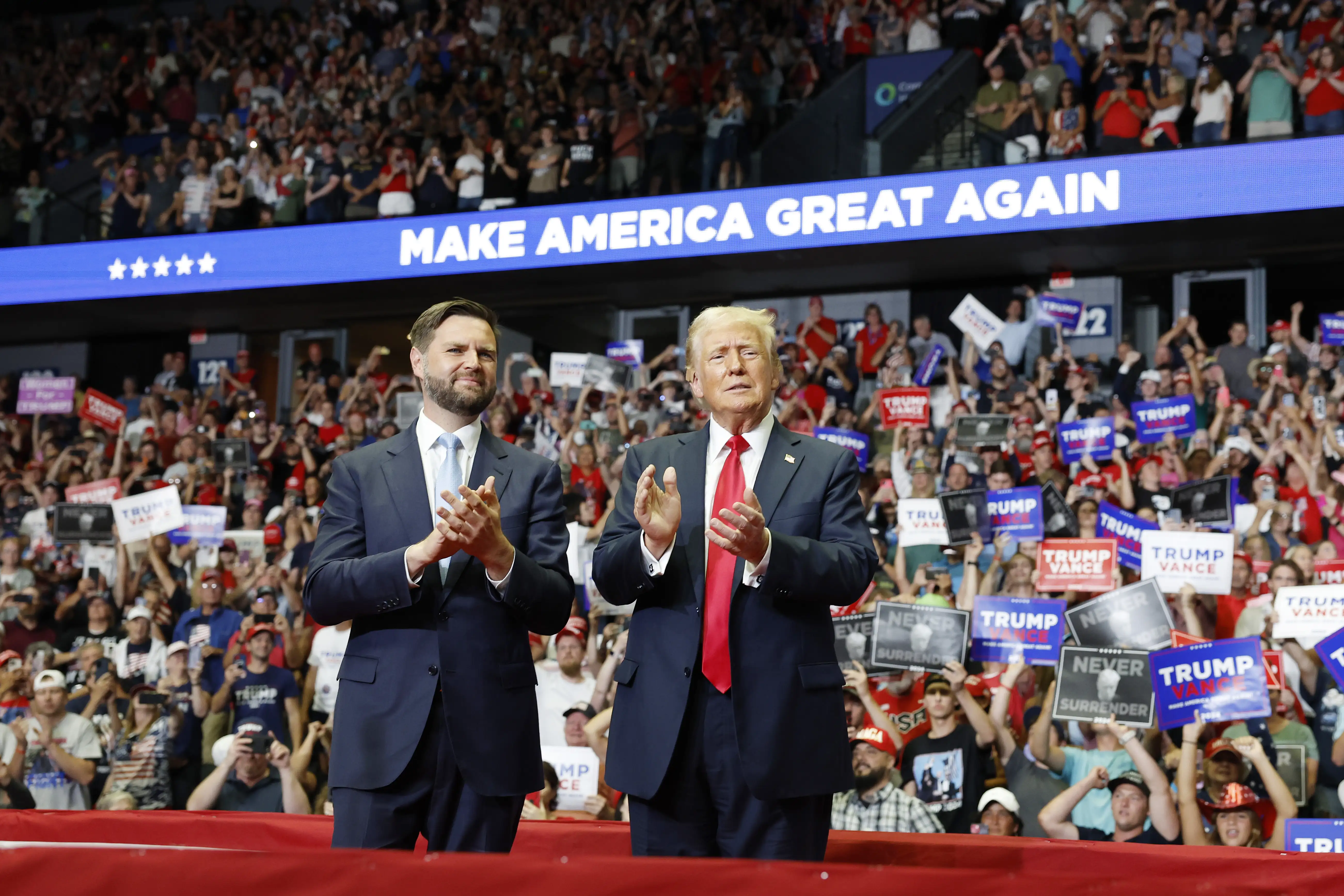 U.S. President Donald Trump stands onstage with Republican vice presidential candidate, Sen. J.D. Vance