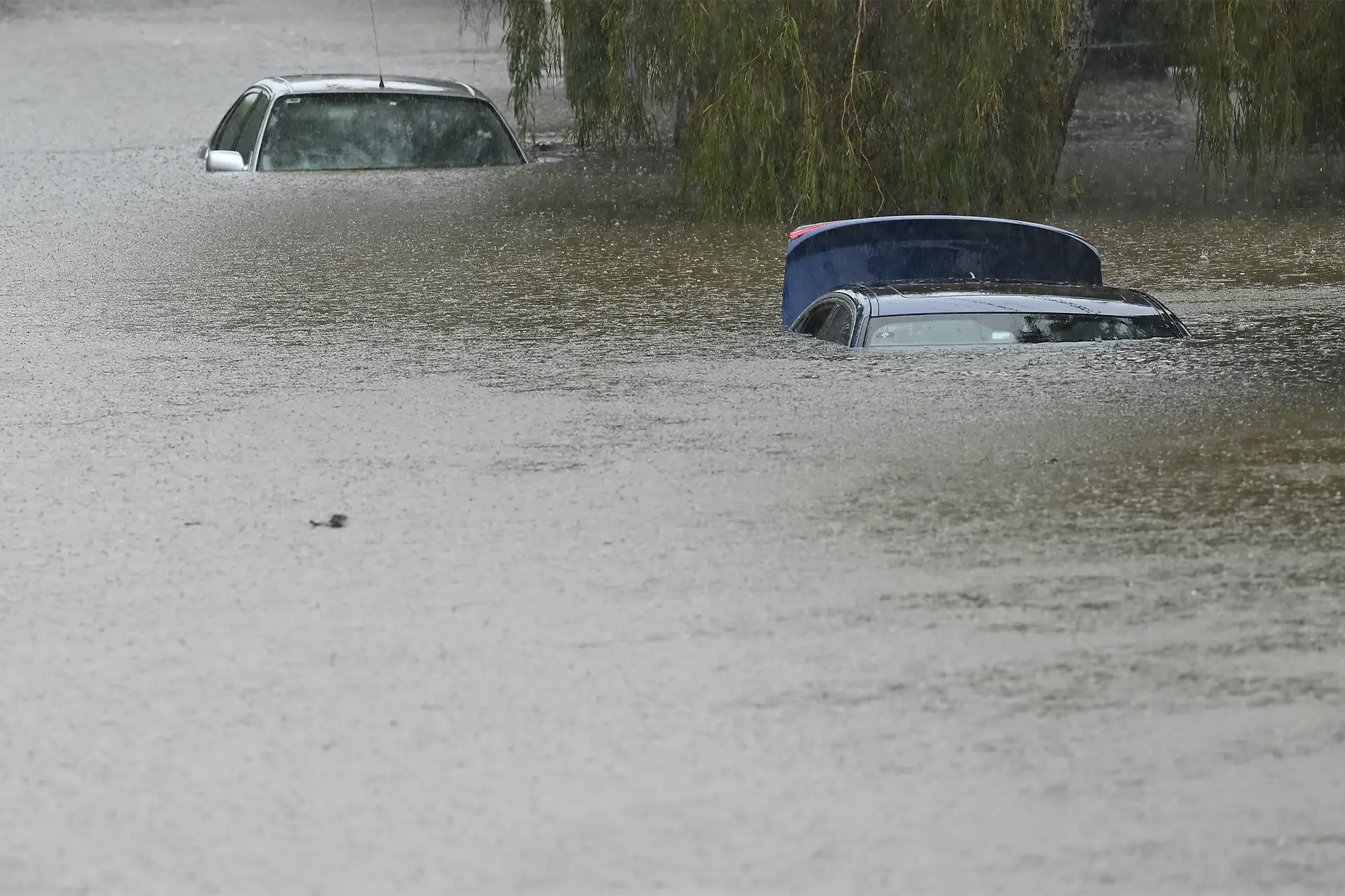 Two cars on a flooded road