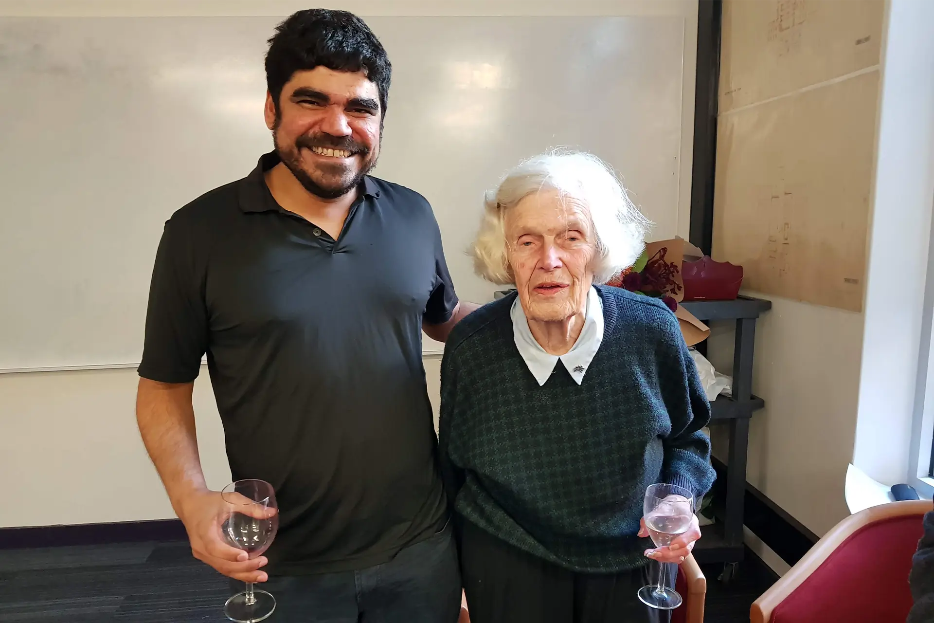 Alysson Costa standing with Alison Harcourt