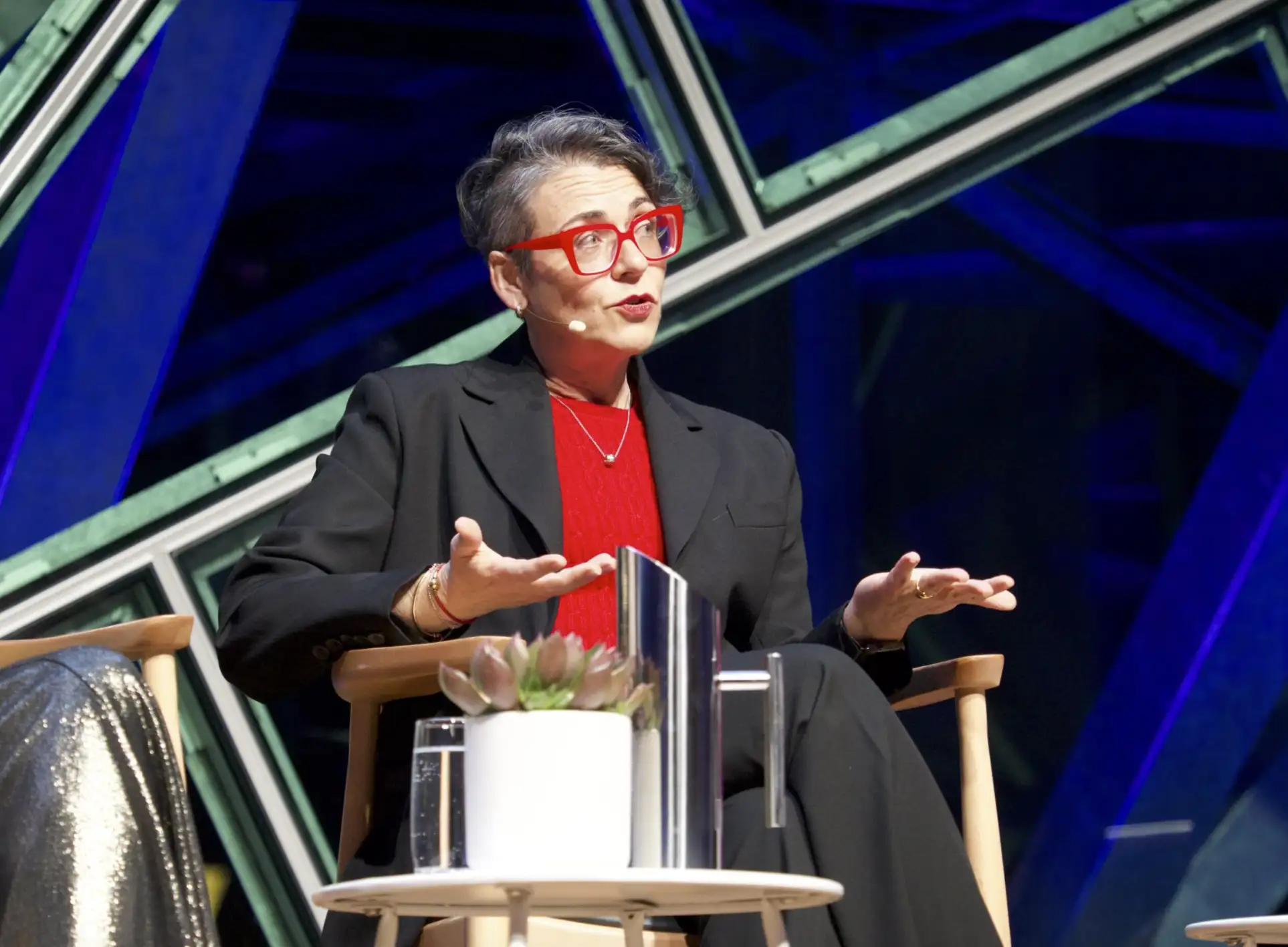 Nadine Hansen on stage during a panel event.