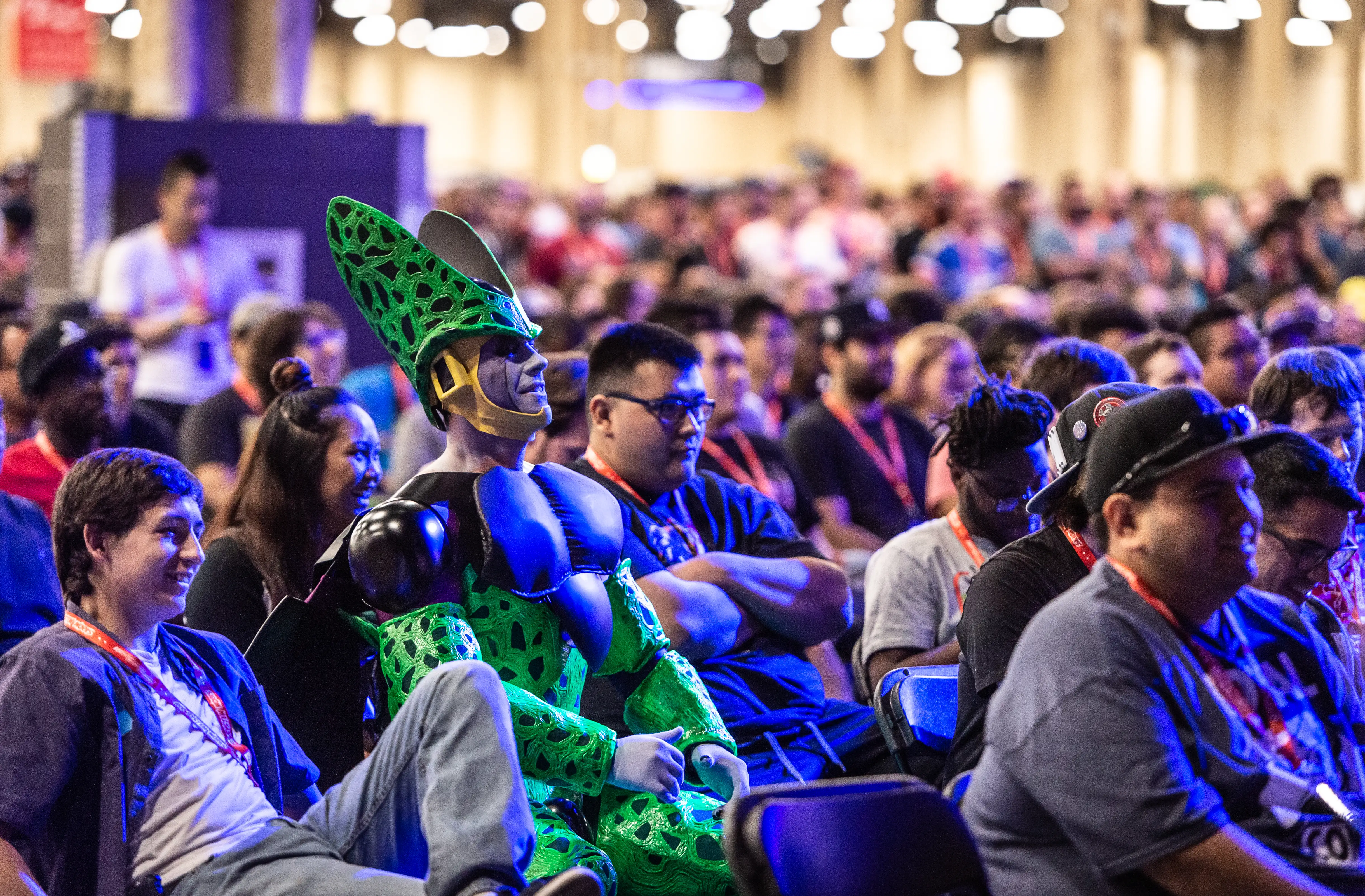 Gamers dress up in cosplay at a crowded gaming convention
