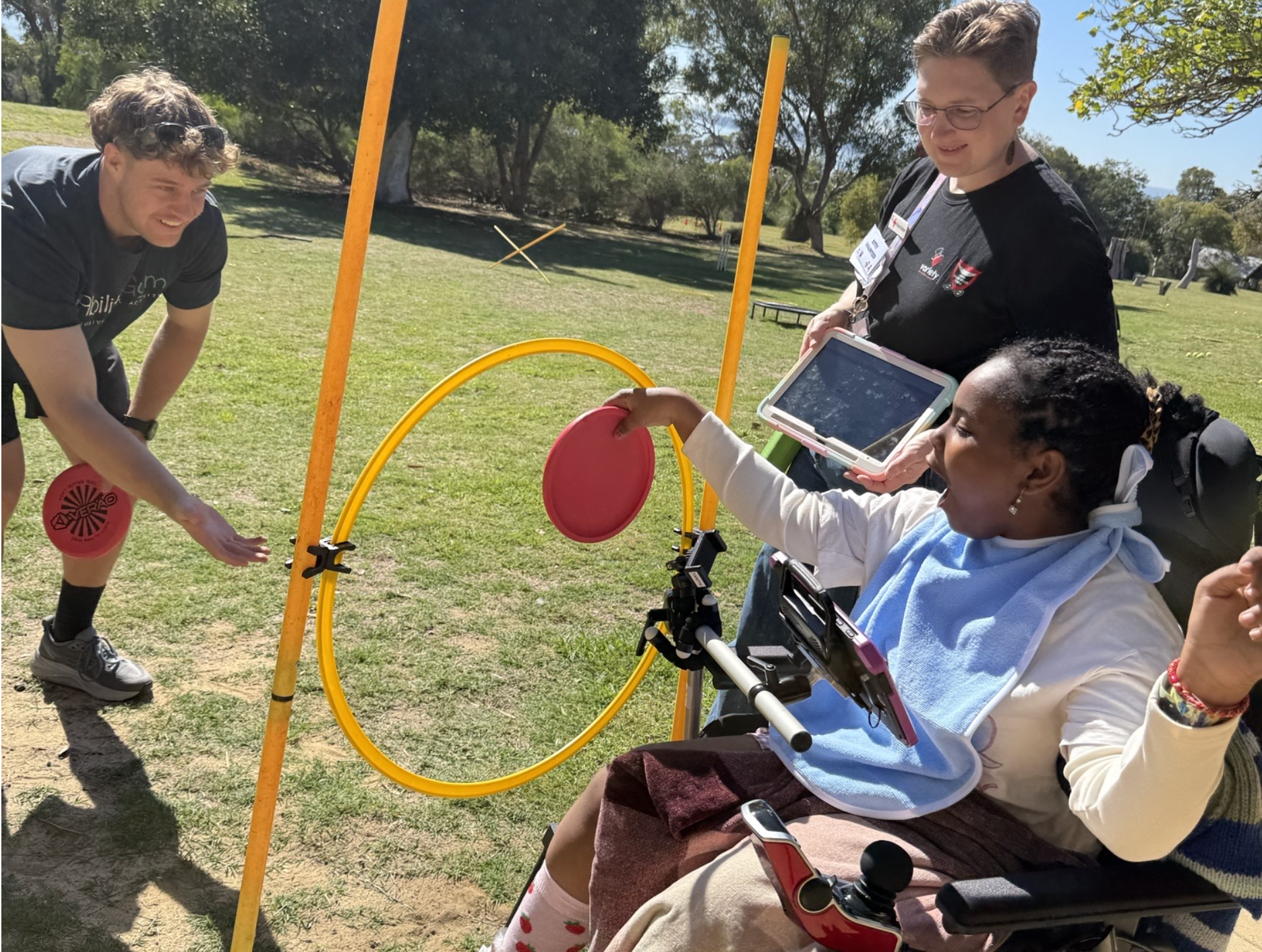 Girl in wheelchair at all ability outdoor gym