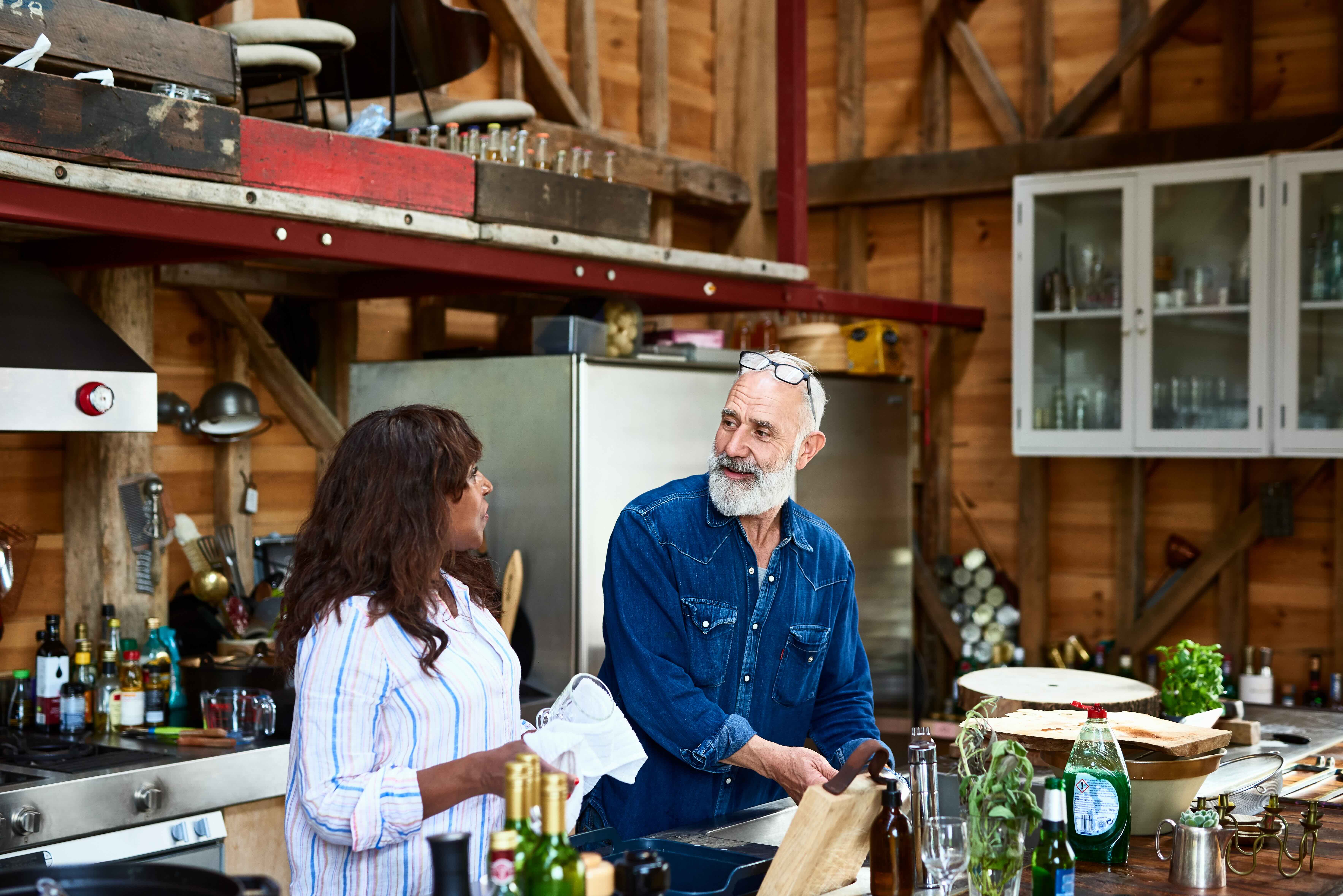 Mature couple washing dishes