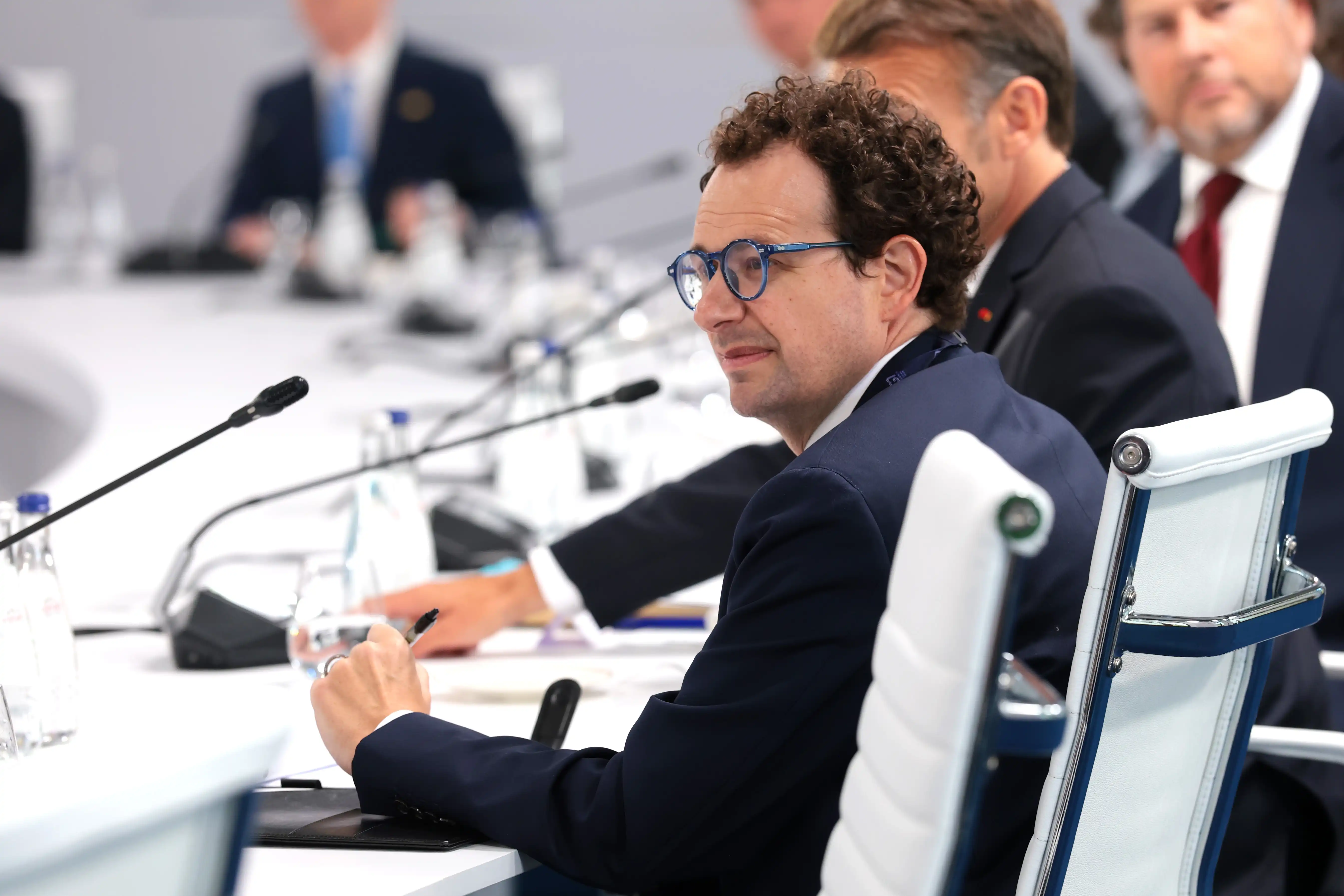 CEO of Anthropic Dario Amodei sitting in a conference room