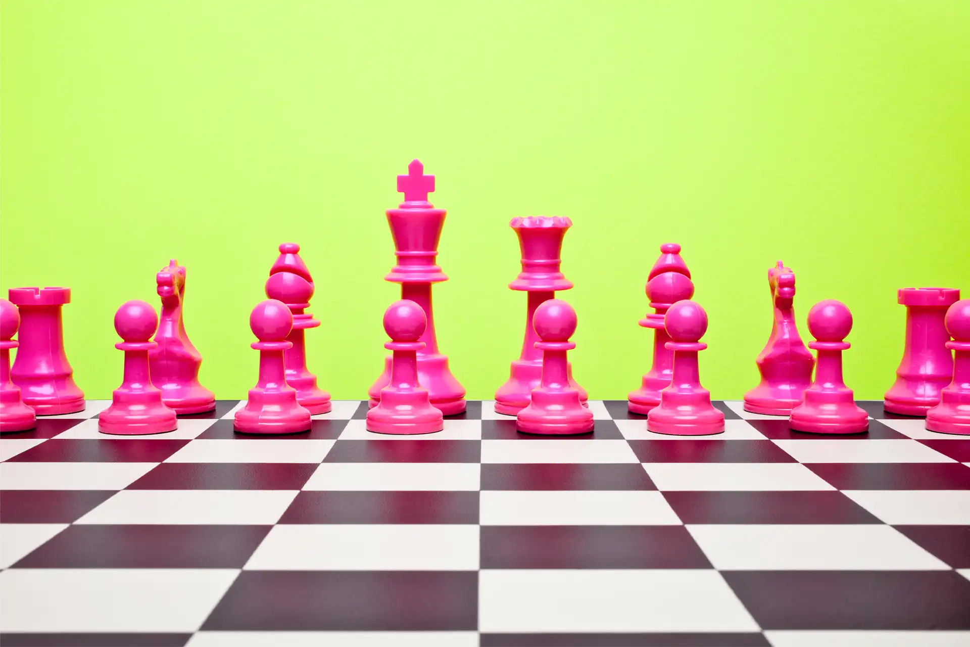Digitally created chess board with pink chess pieces