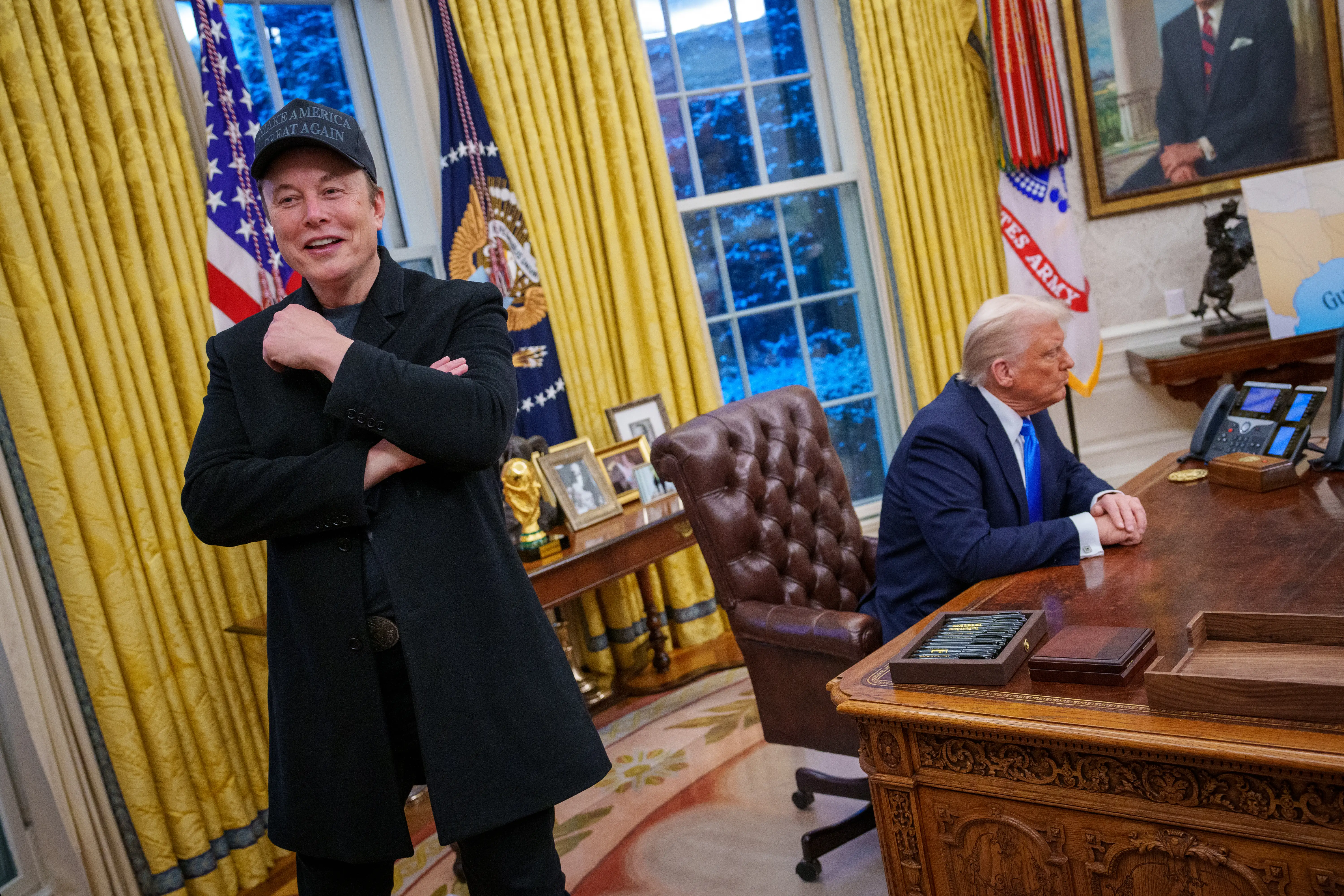 Elon Musk and U.S. President Donald Trump appear during an executive order signing in the Oval Office