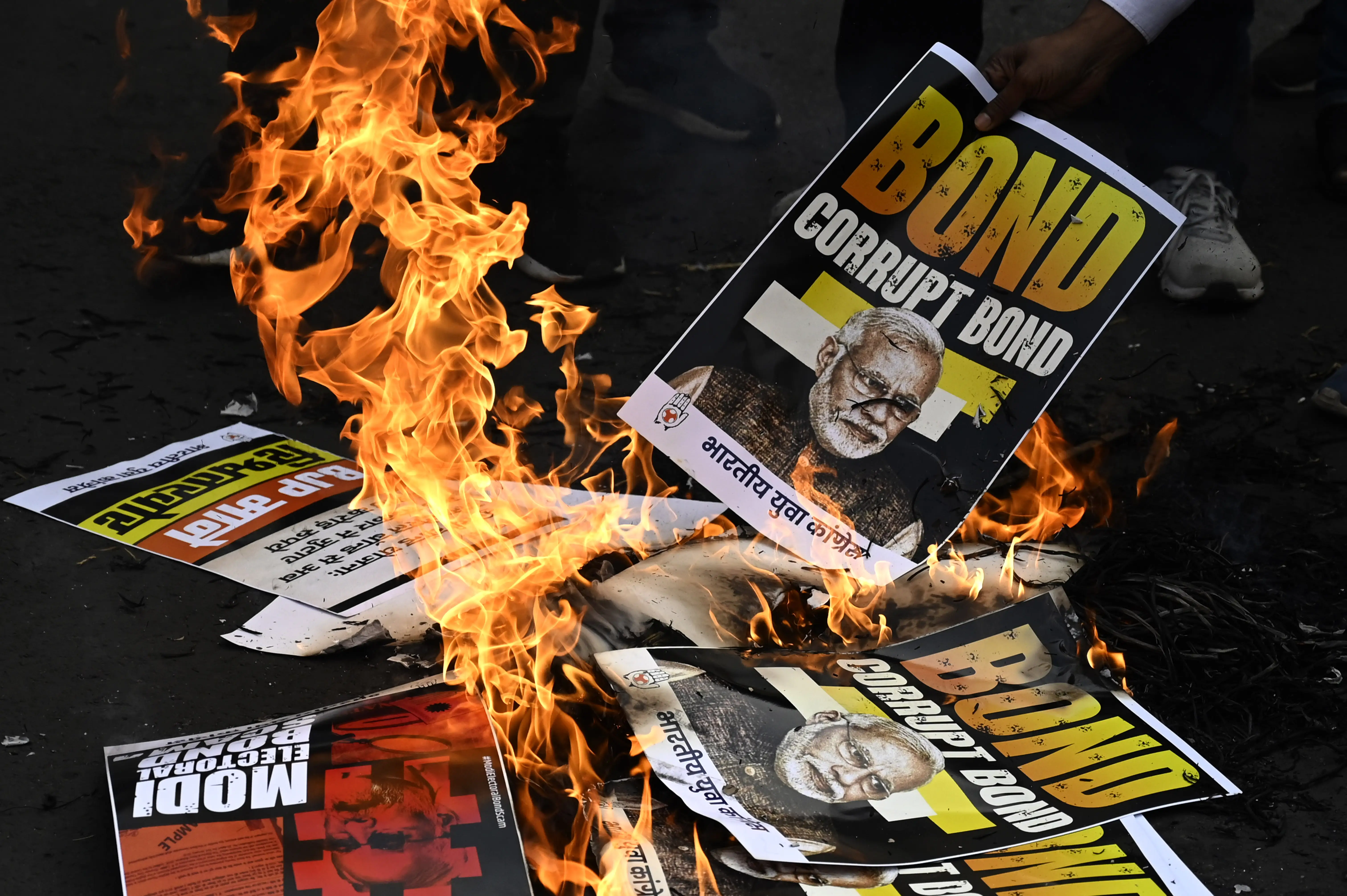 Protestors burn an effigy of Indian Prime Minister Narendra Modi
